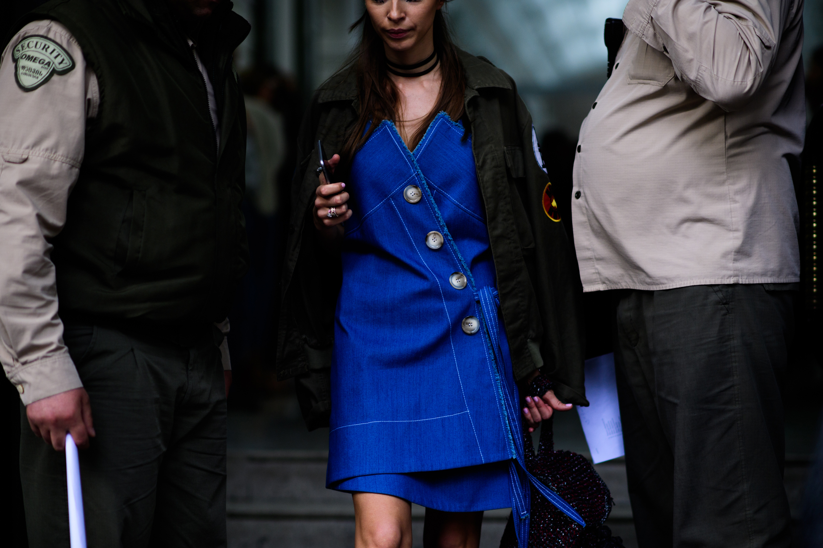 Model and designer wearing denim dress