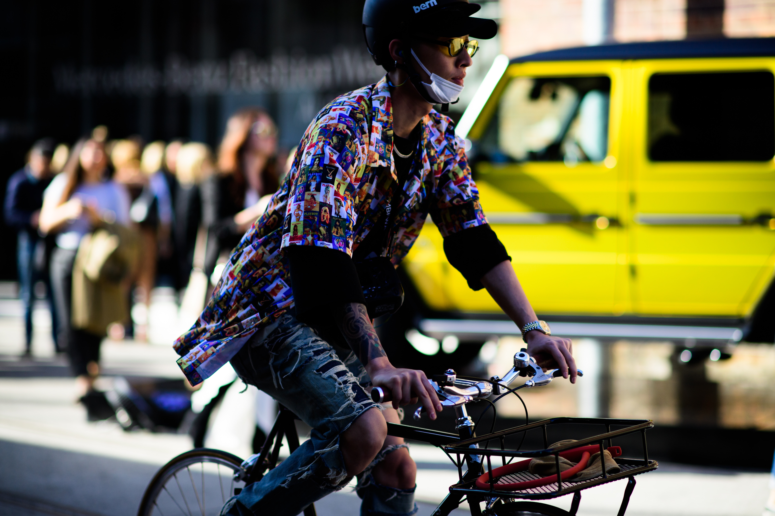 Korean photographer riding a bike yellow glasses