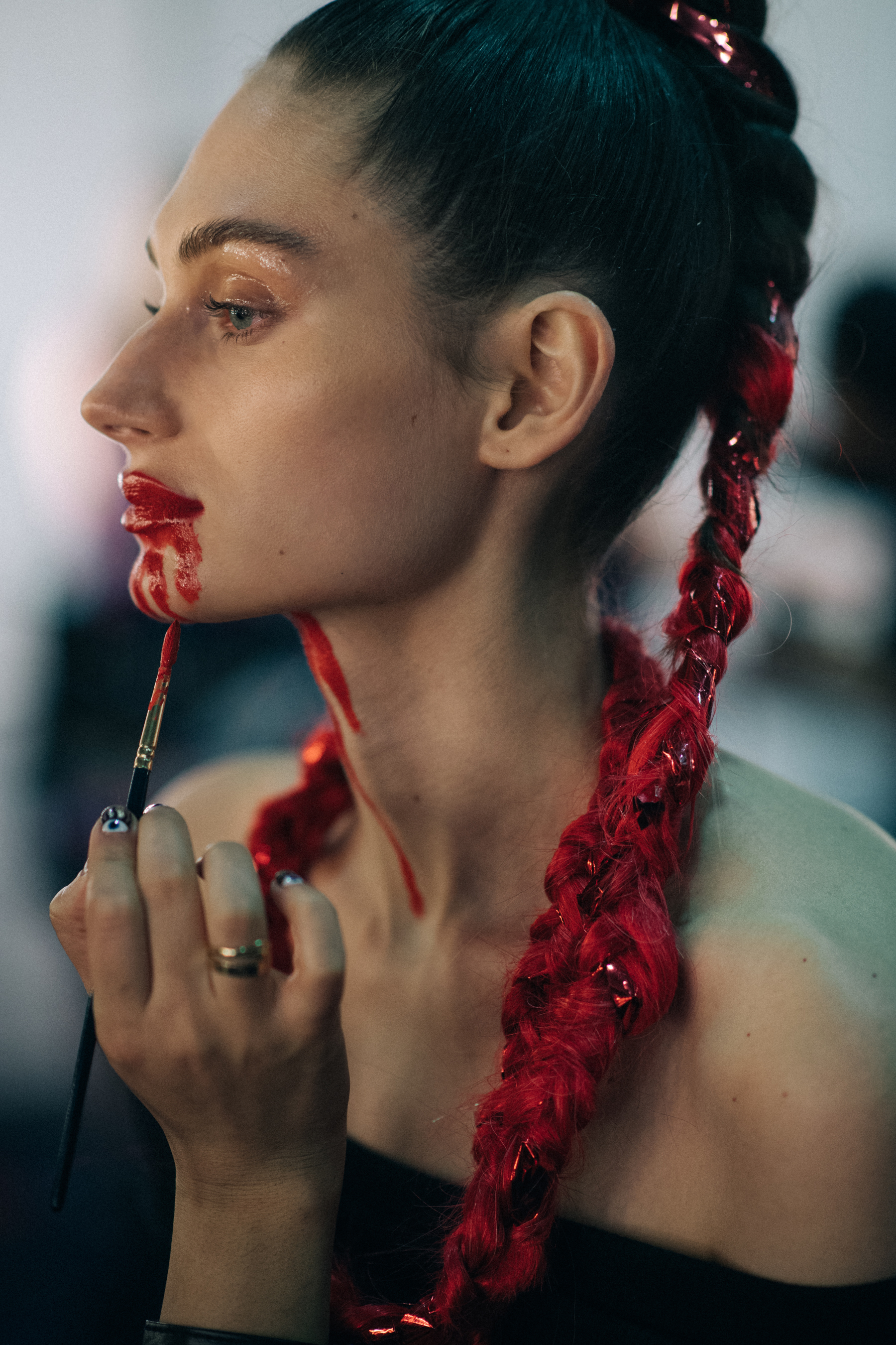 Noam Frost with red braids