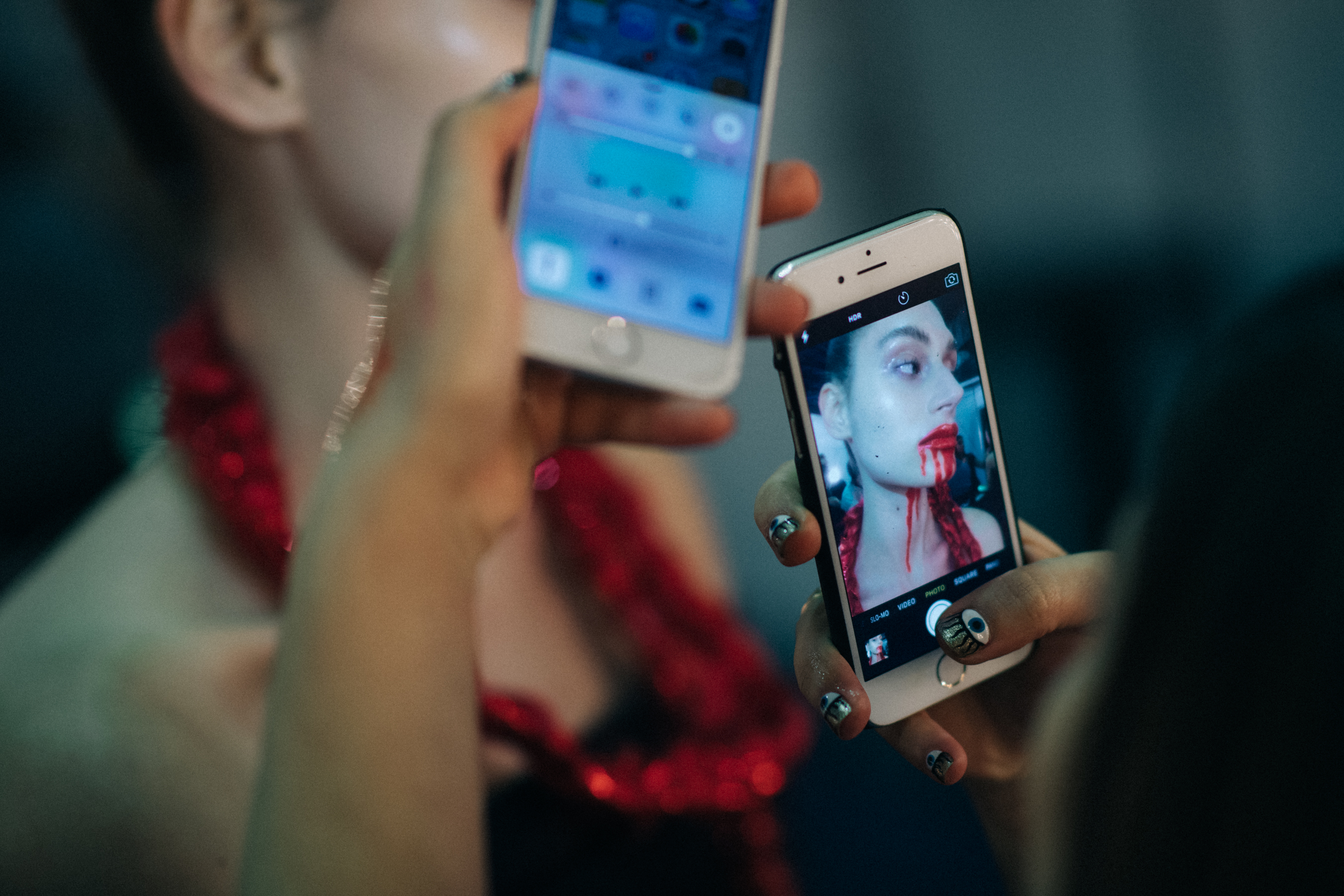 Models taking pictures of each other