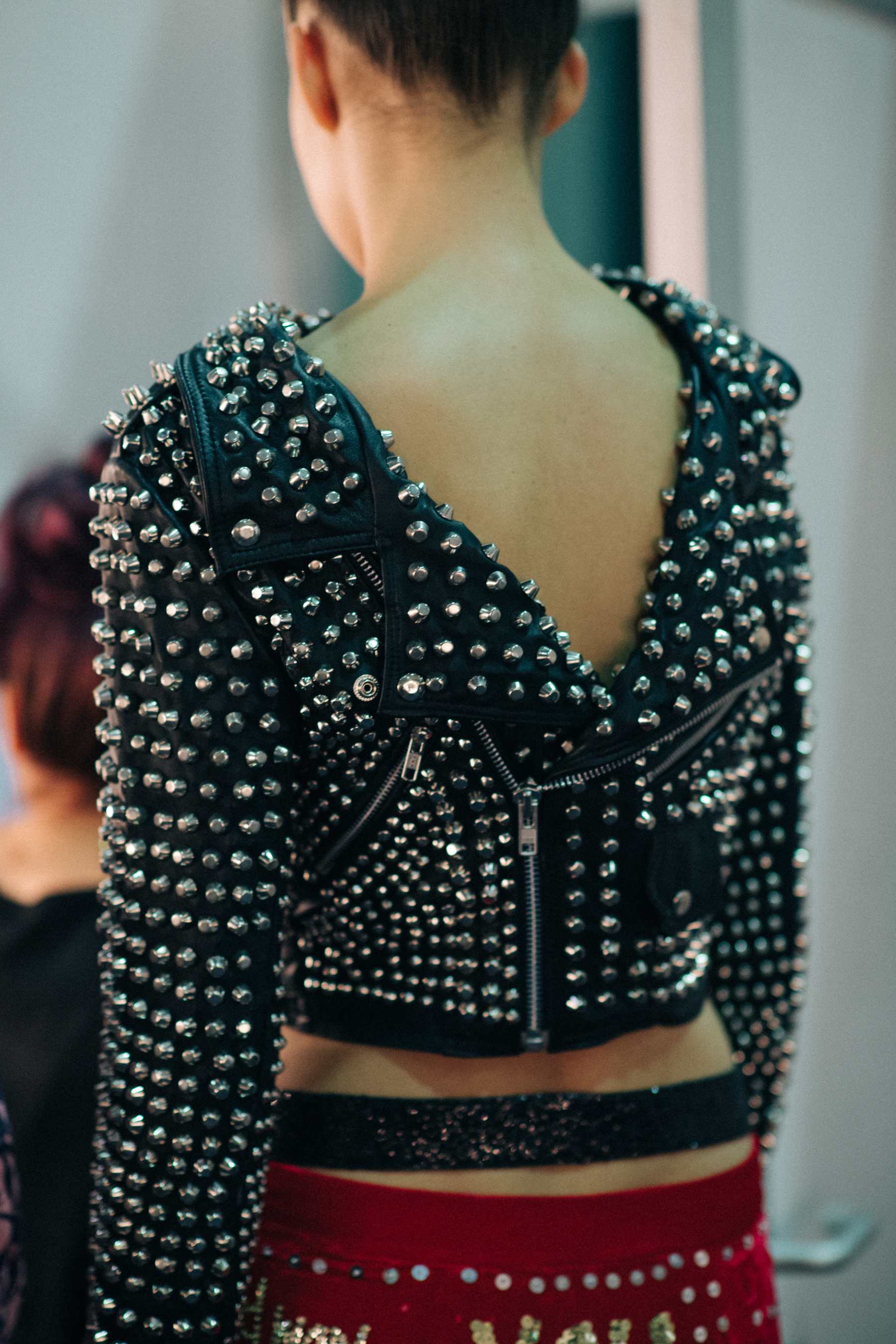 Black studded jacket worn backwards