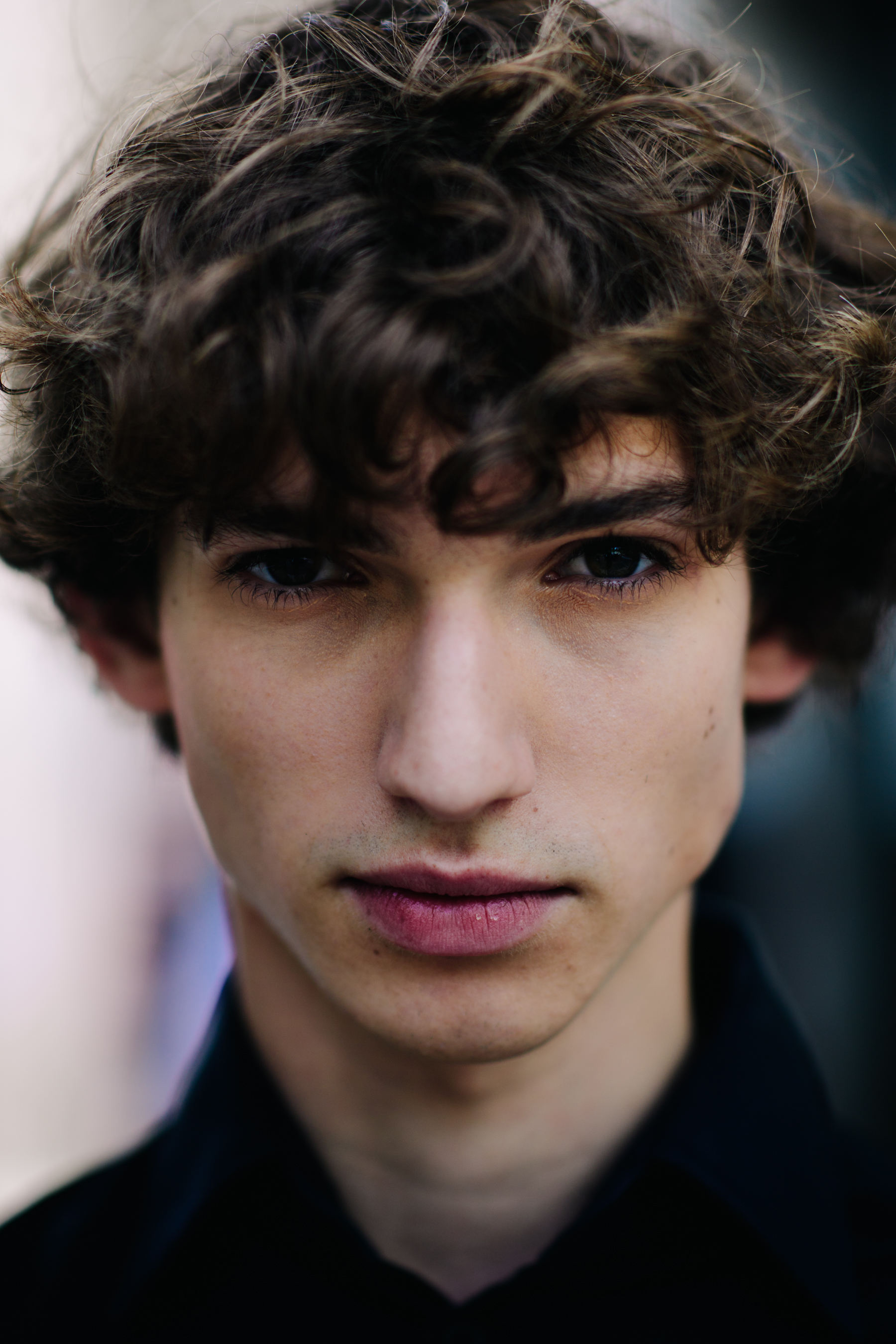 Portrait of a curly-haired male model