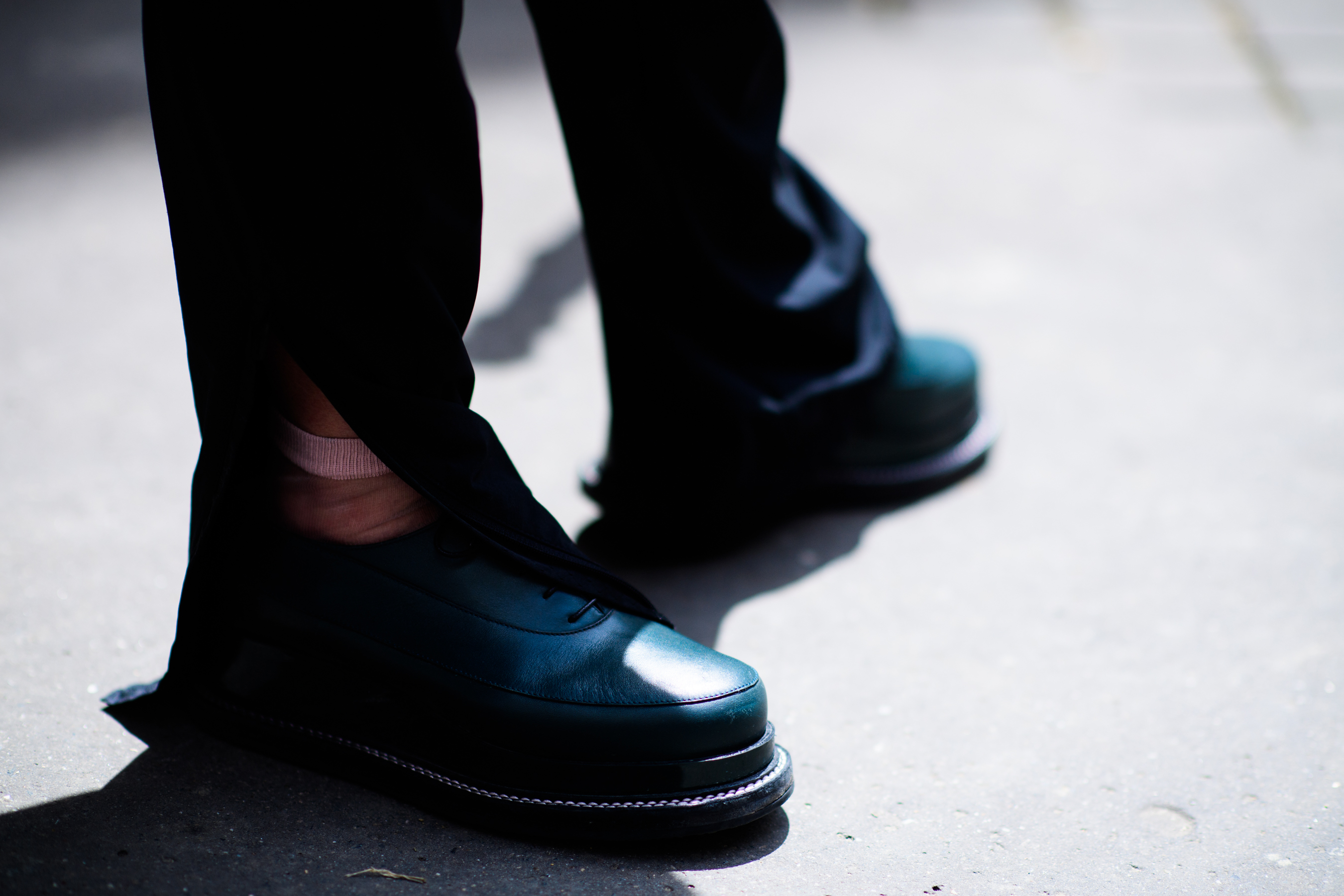 Black shoes and trousers with slits