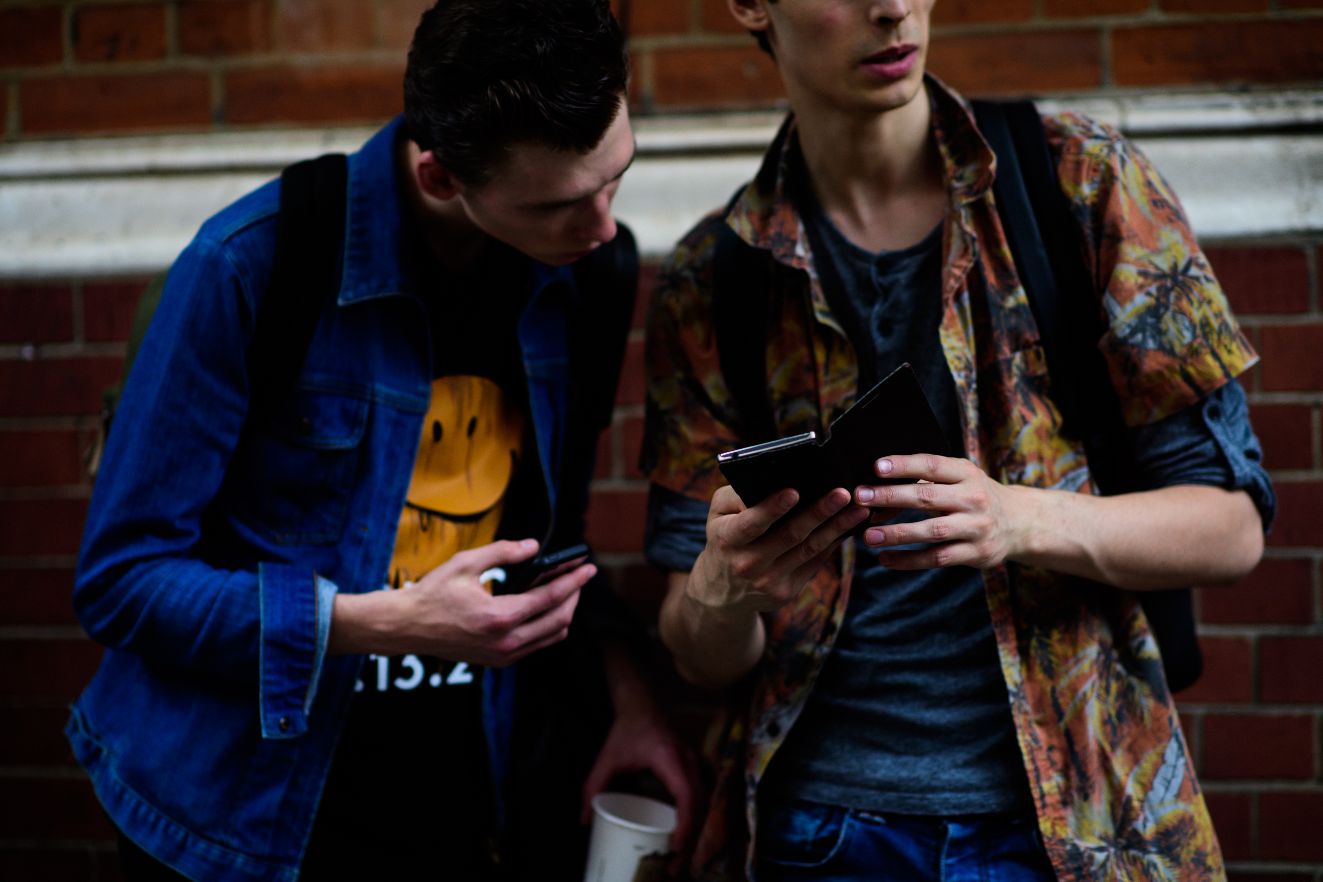 Two models on their phones