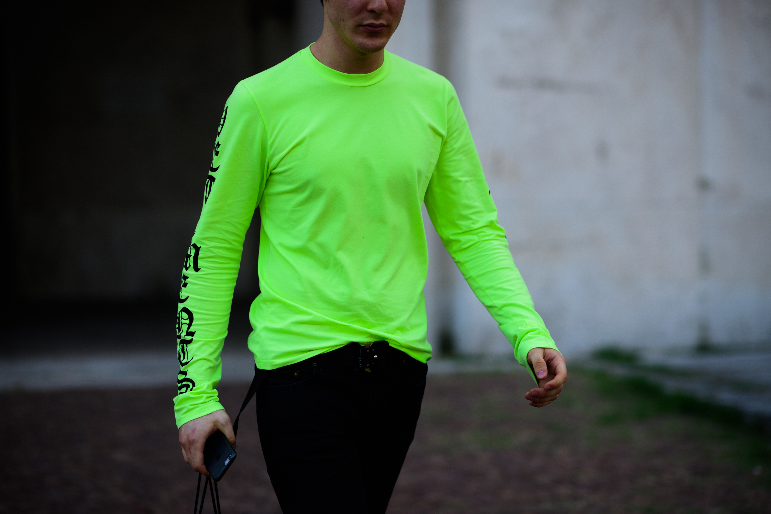 A man wearing neon green top
