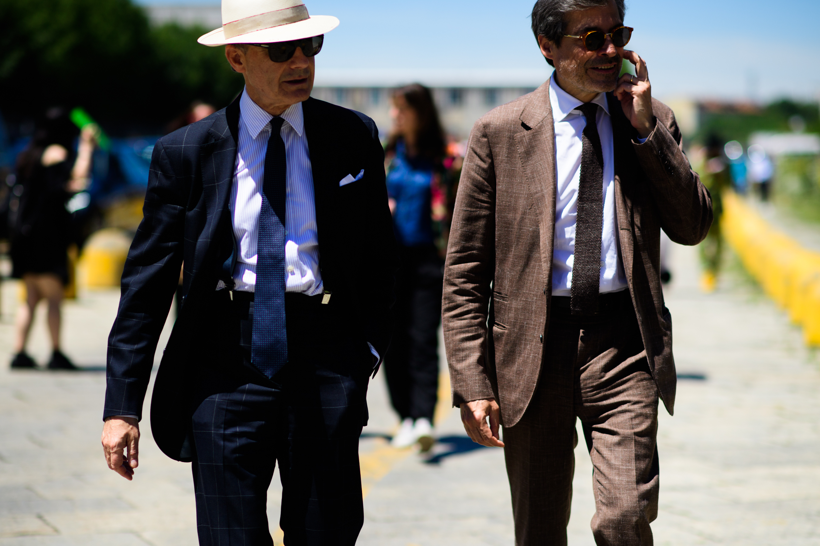 Men in blue and brown suits