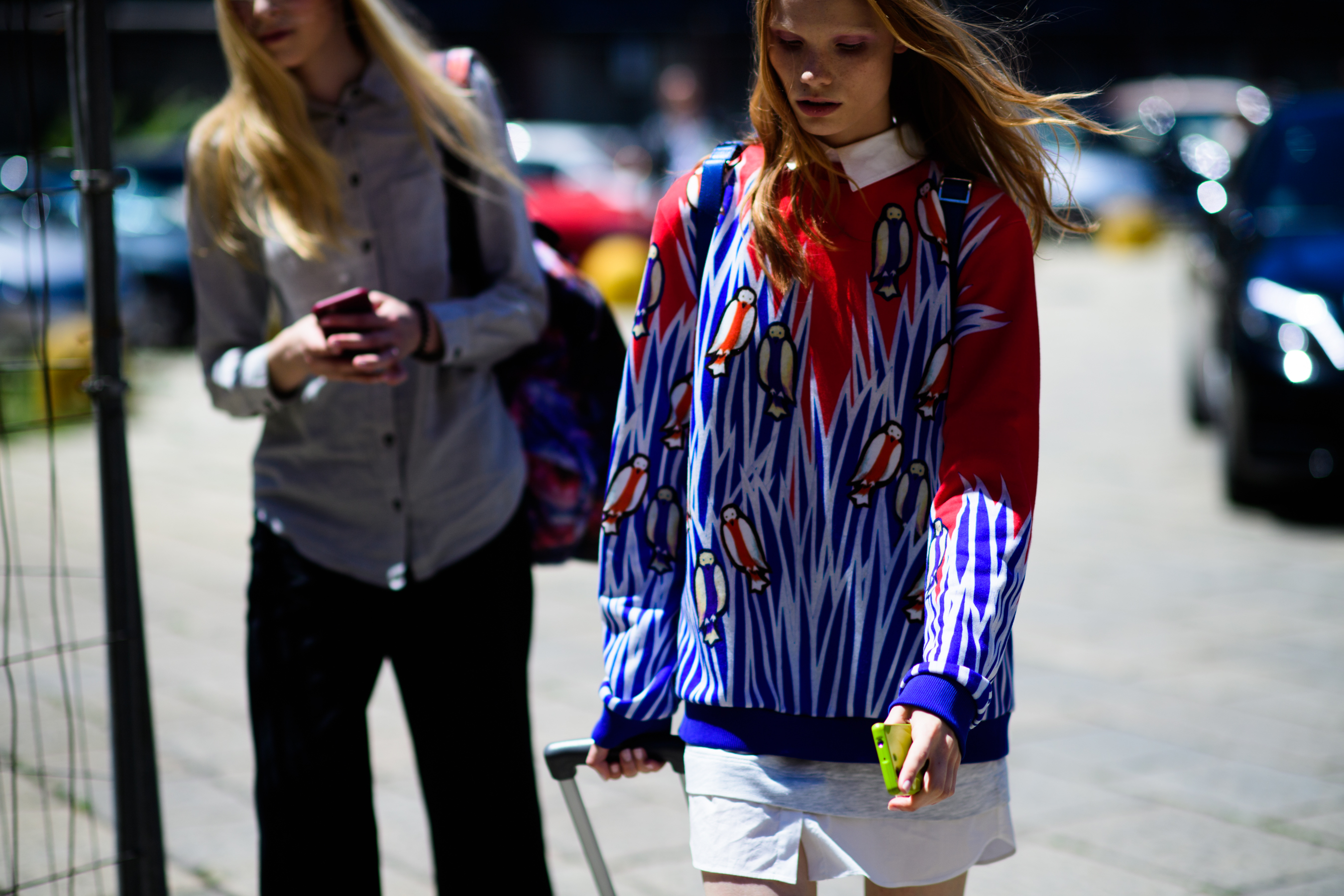 A girl wearing a printed sweater