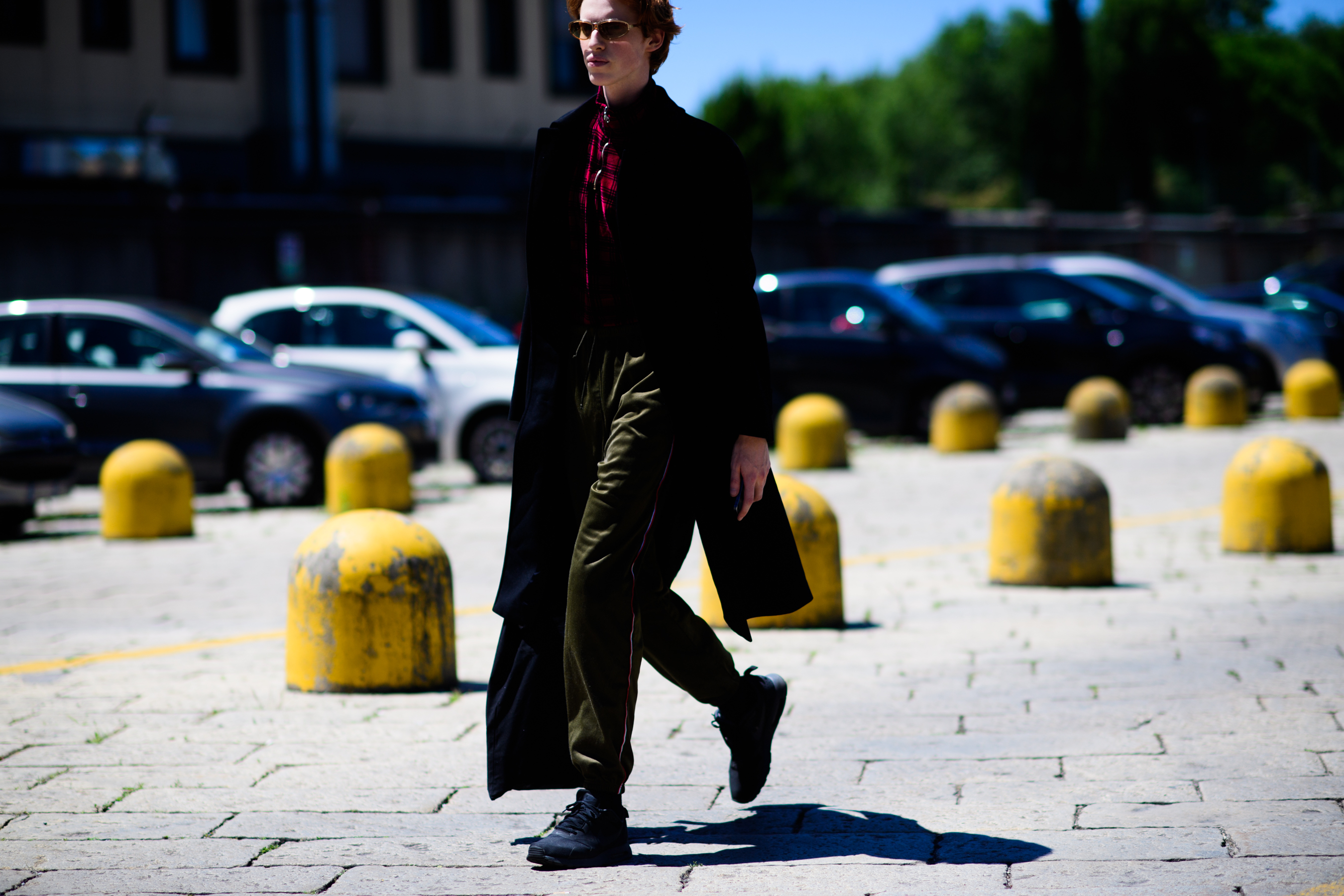 A man in a long black coat