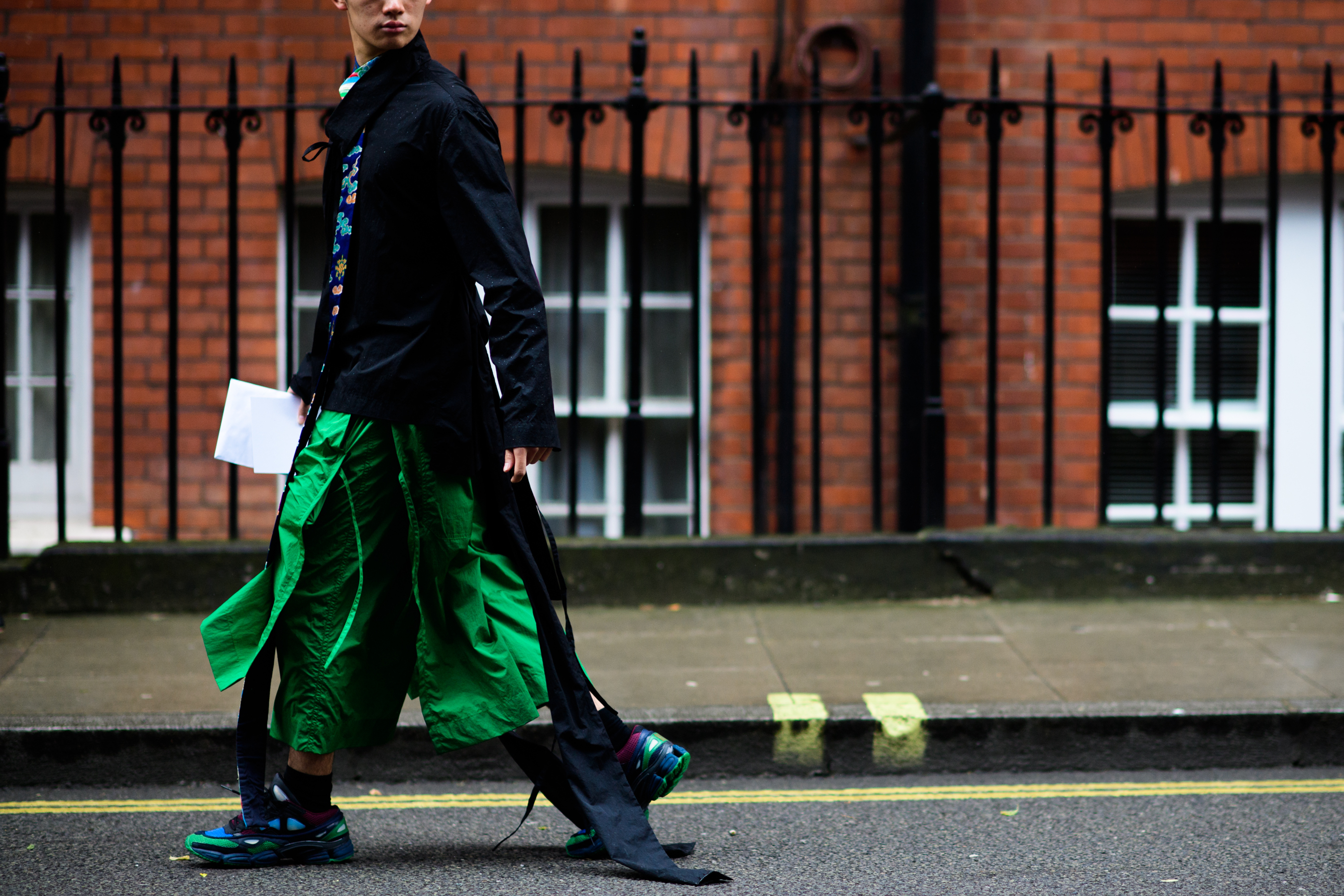 A man wearing bright green trousers