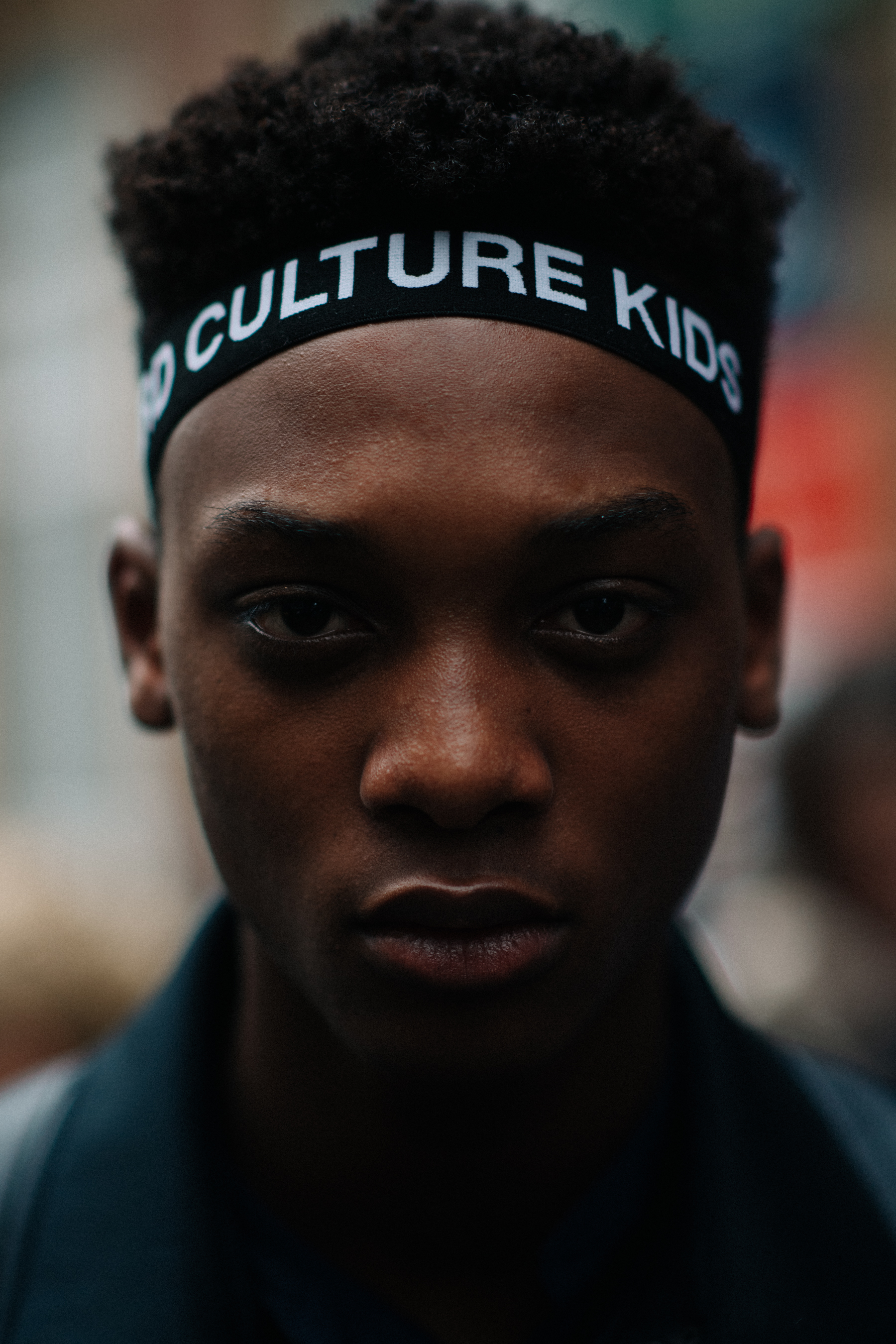 A portrait of a male model outside