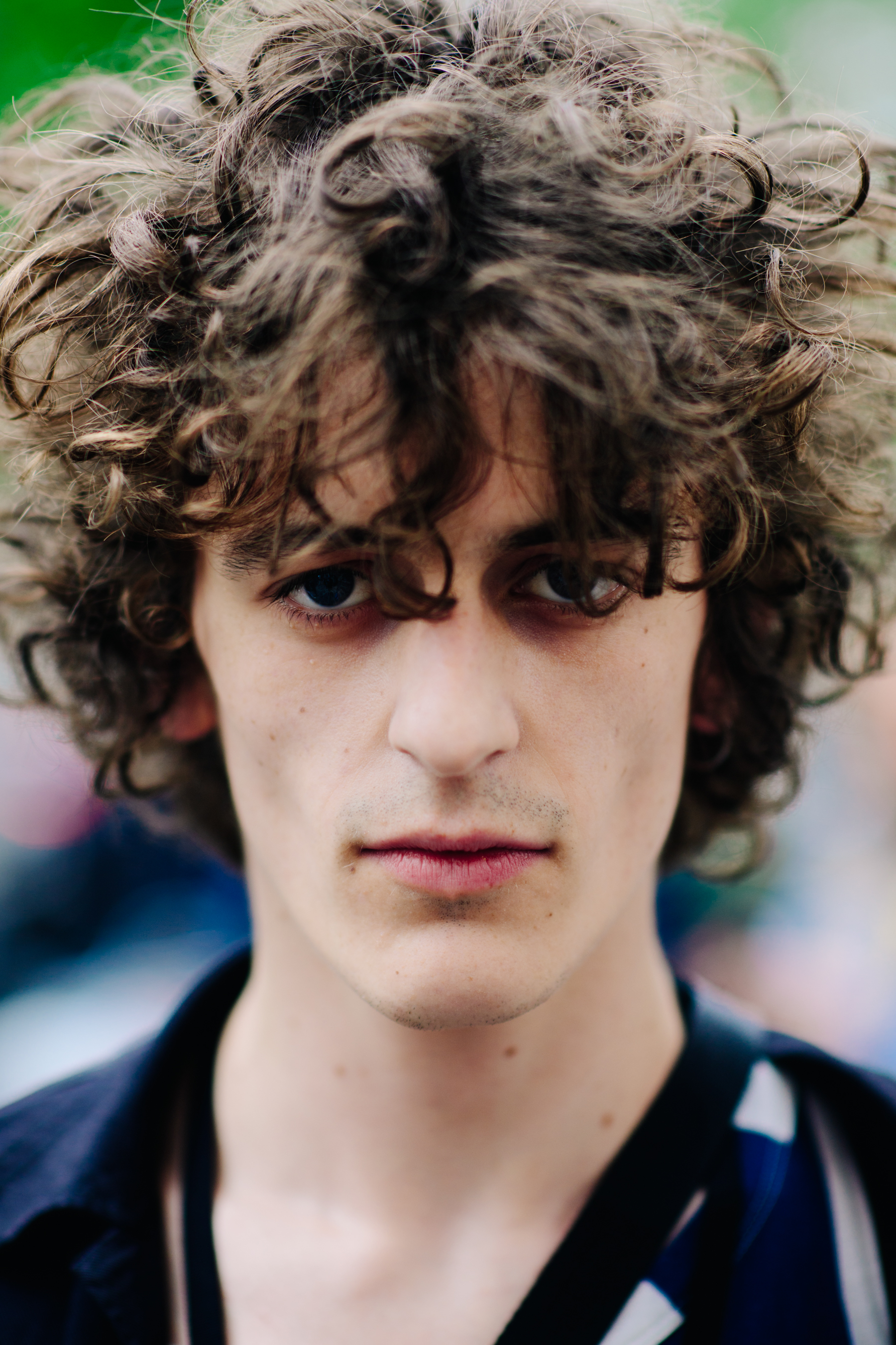 Portrait of curly-haired male model