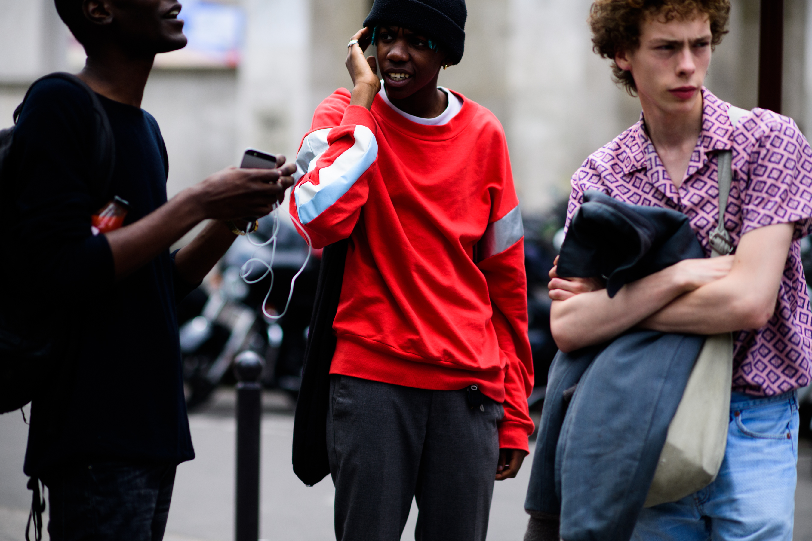 Red sweatshirt with grey trousers