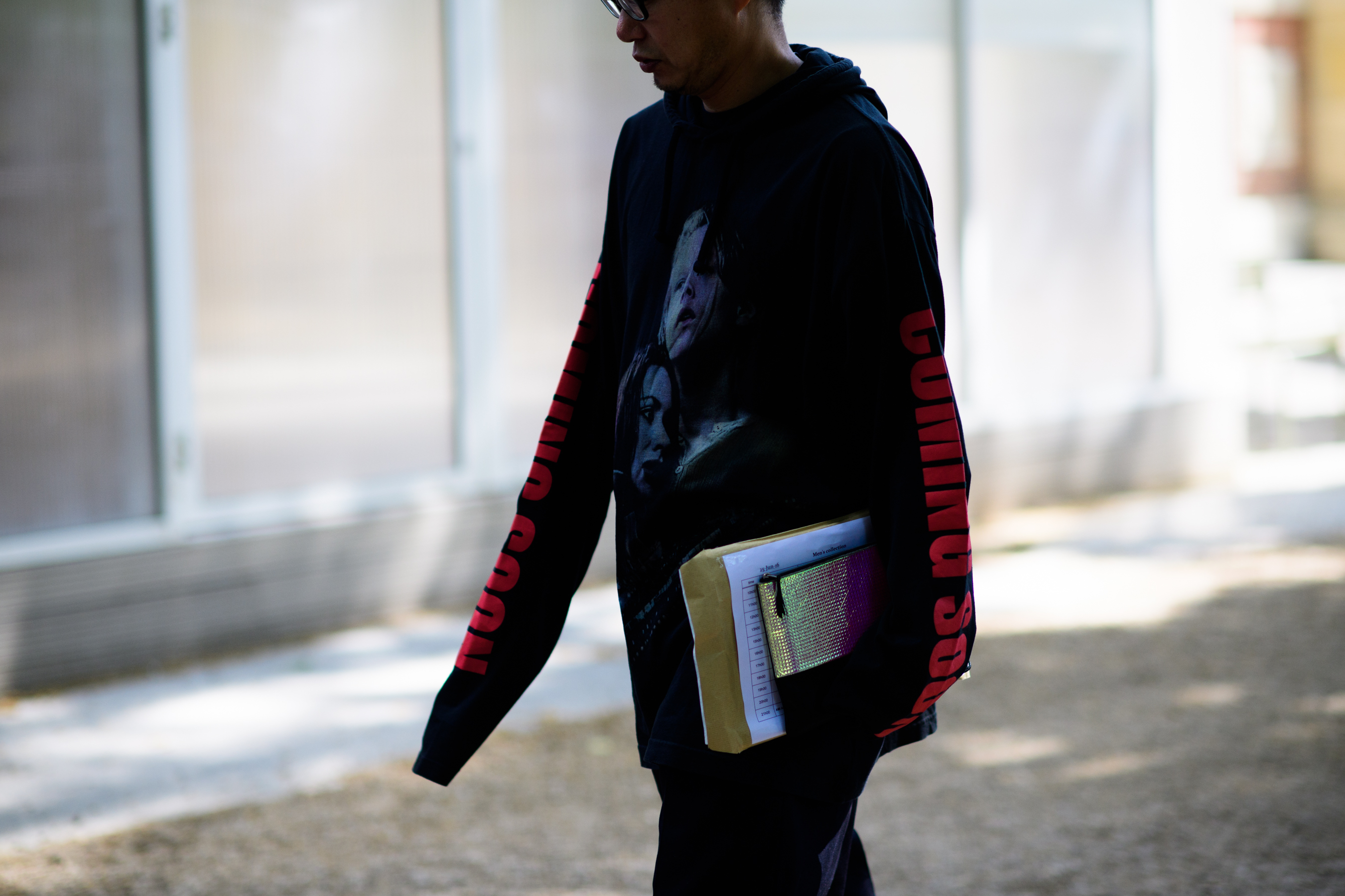 Man wearing black printed sweatshirt