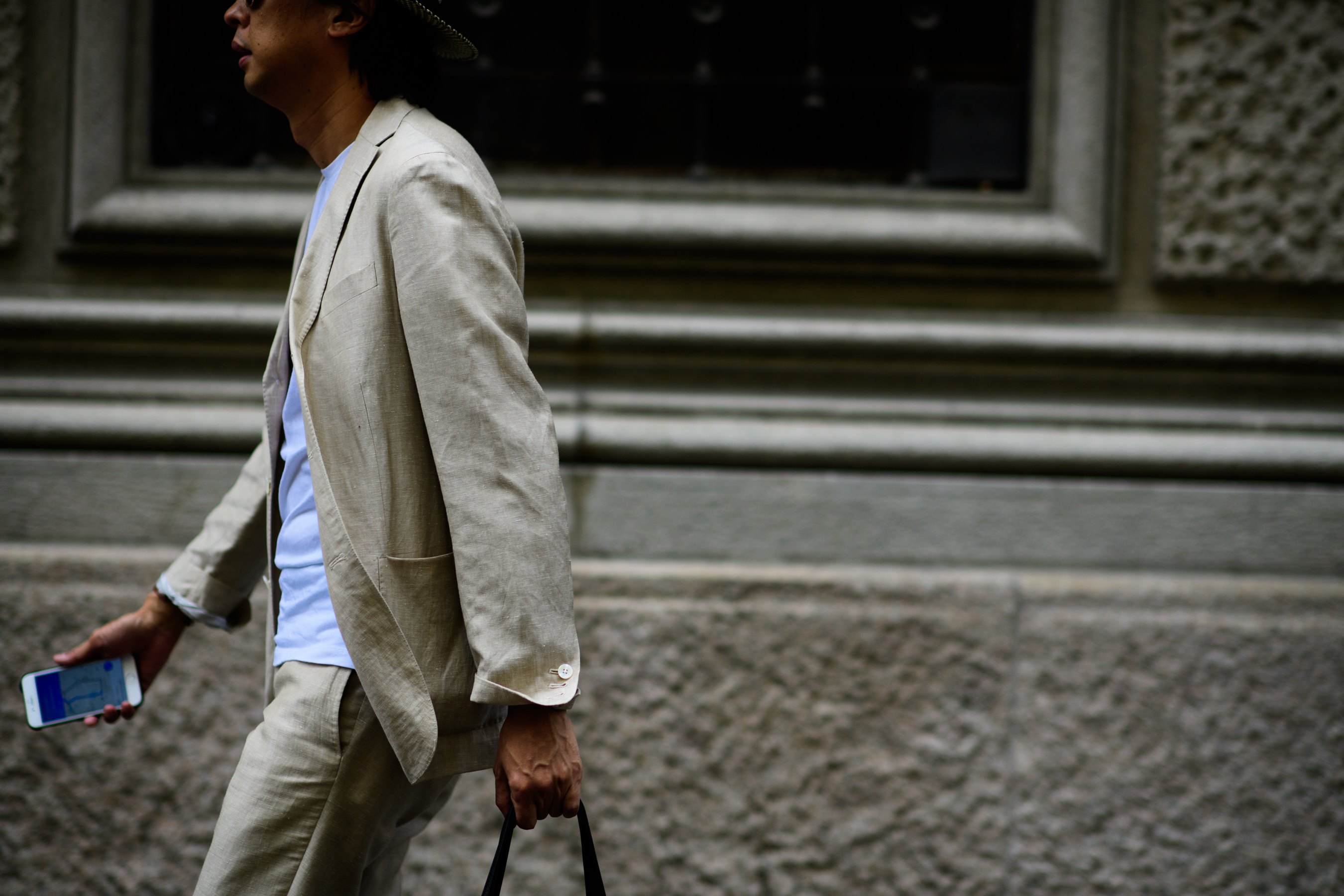 A man in a beige suit