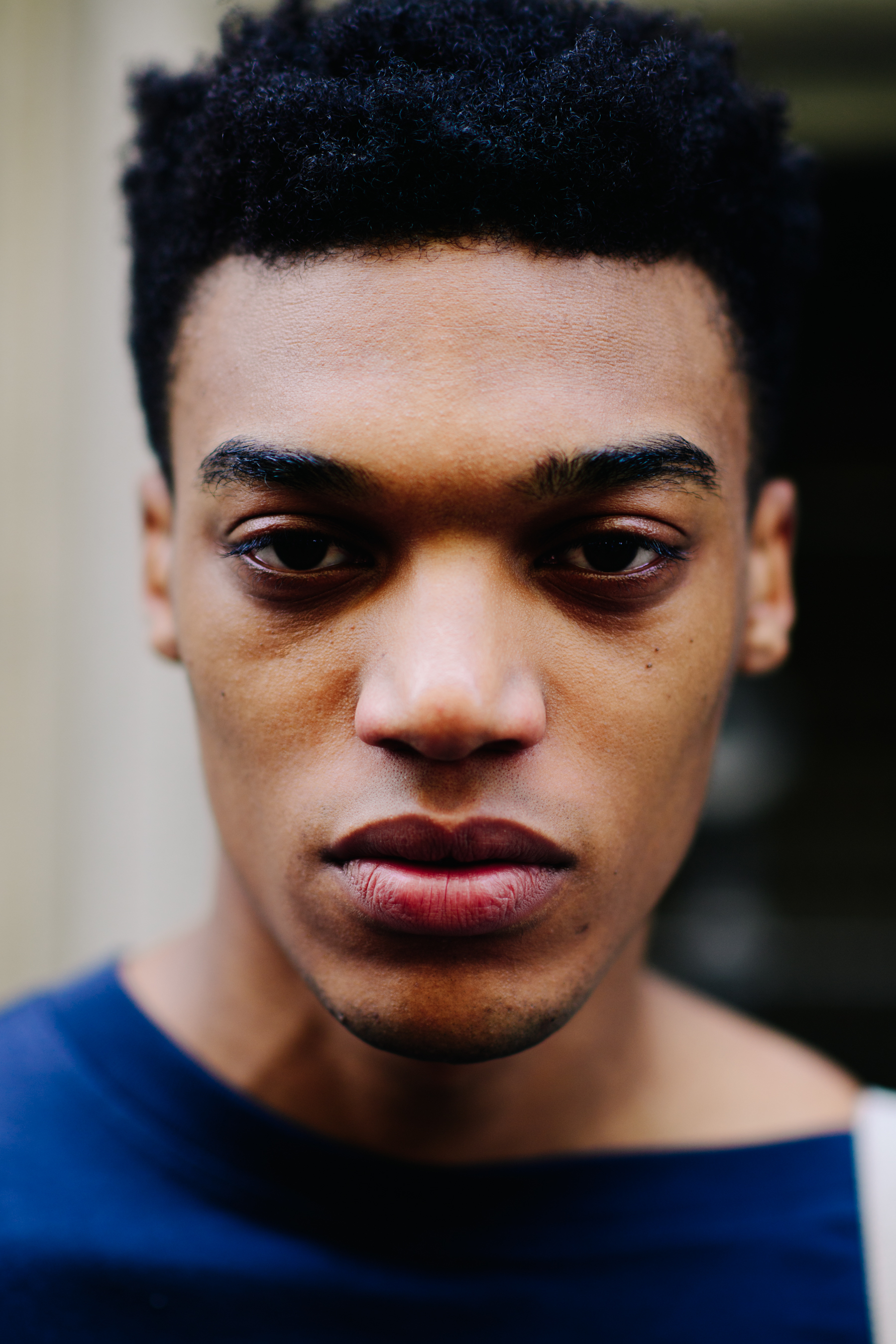 A portrait of a dark-skined model