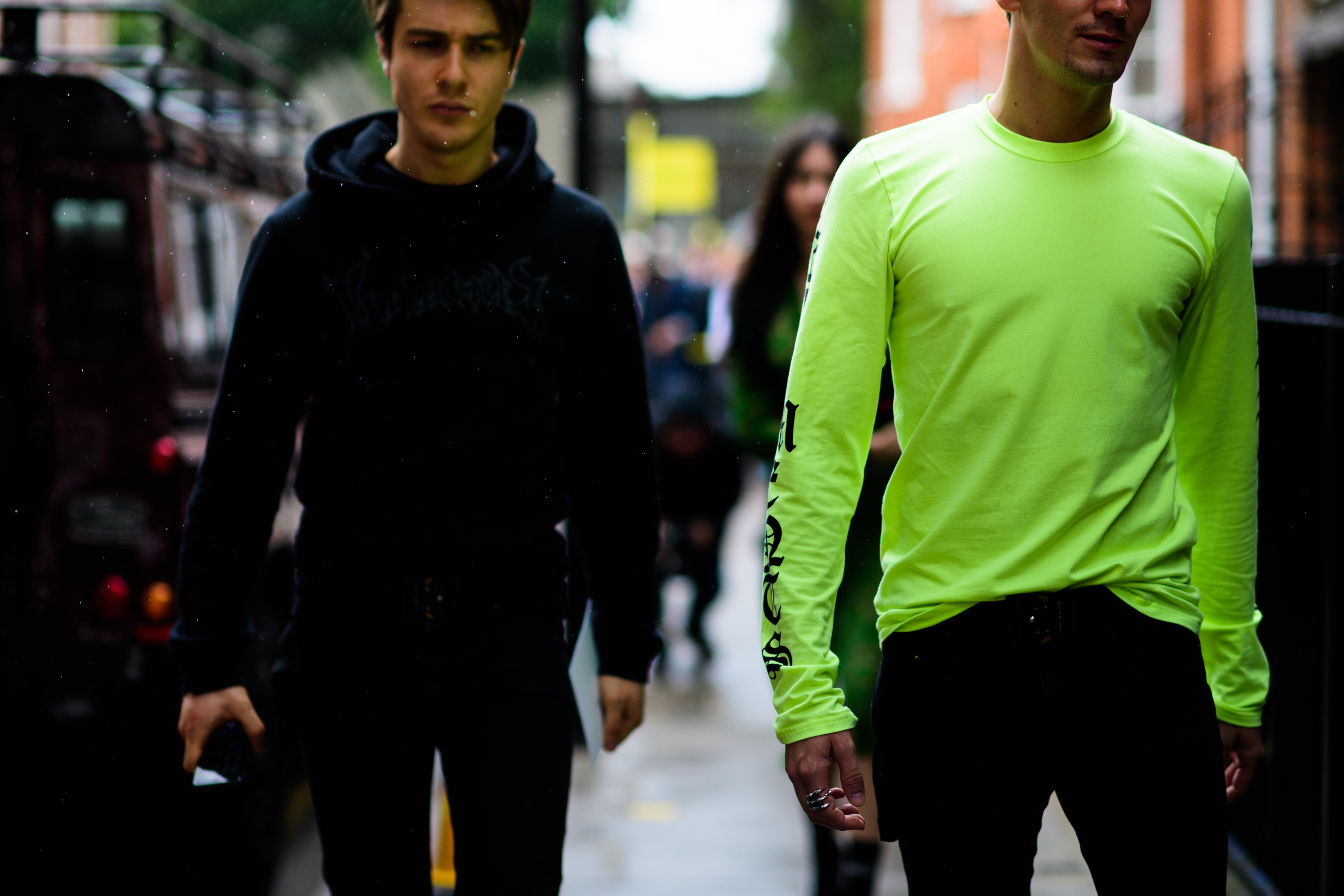 Two male models walking outside