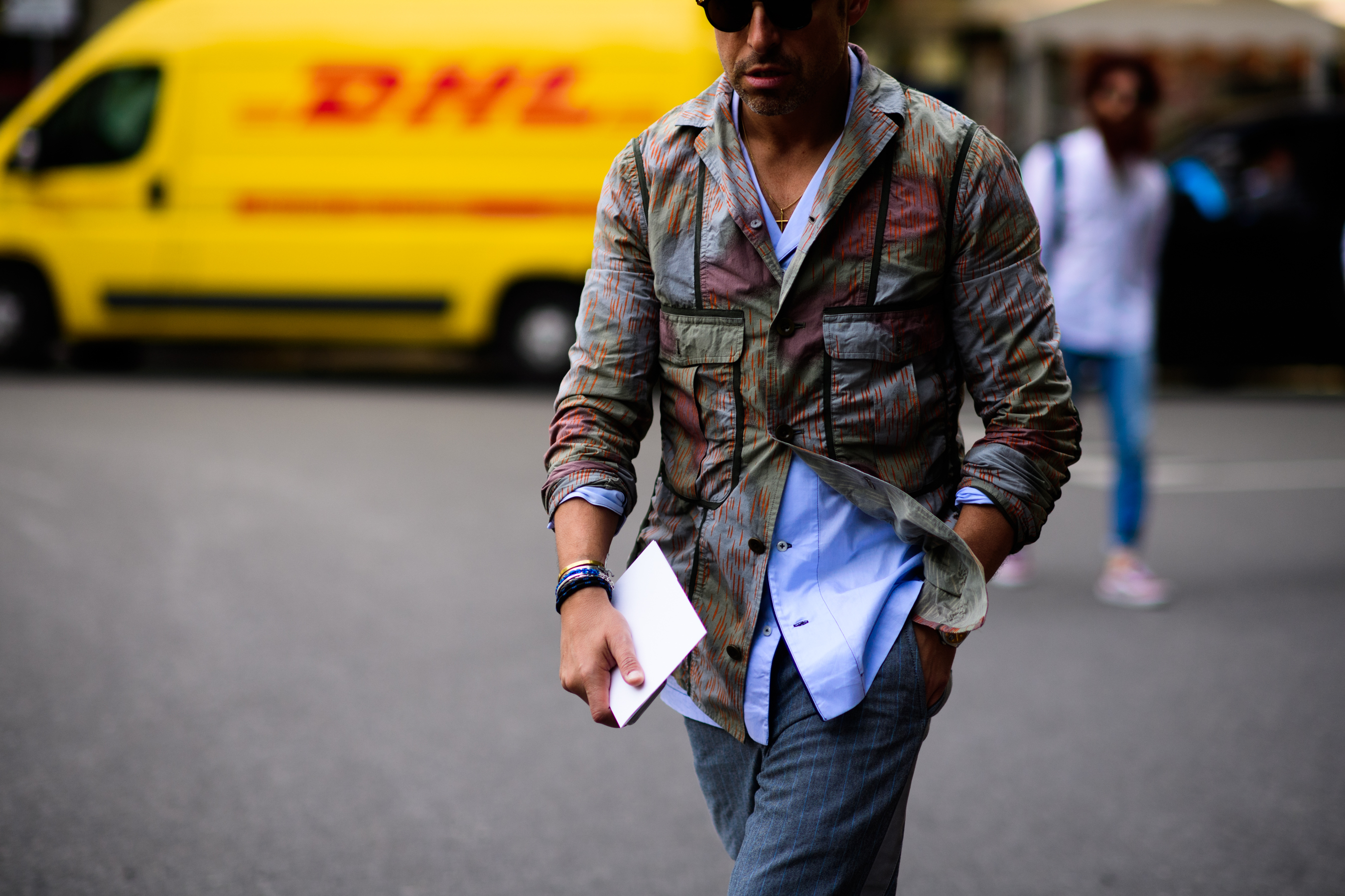 A man in a light brown jacket