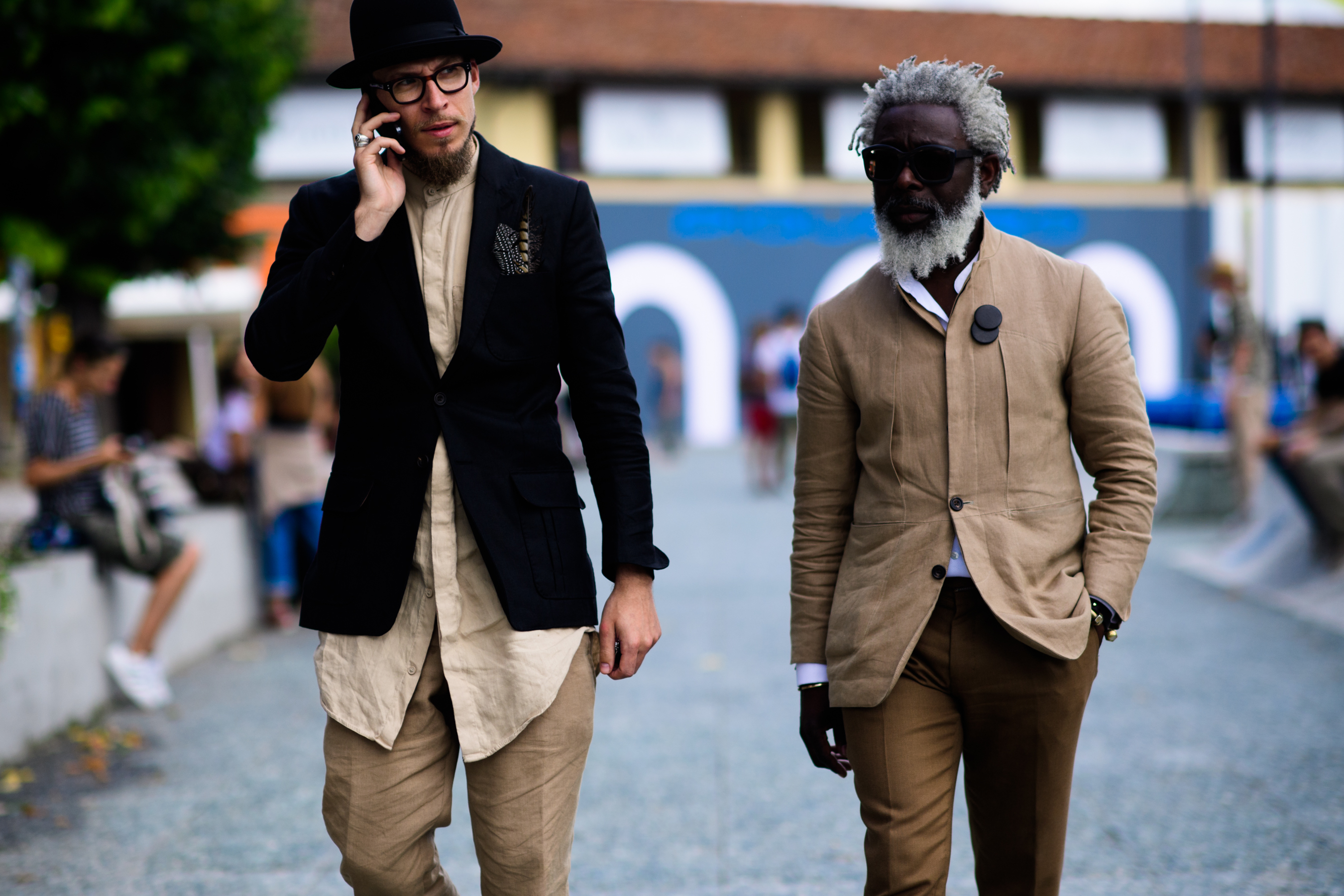 Two men in beige trousers