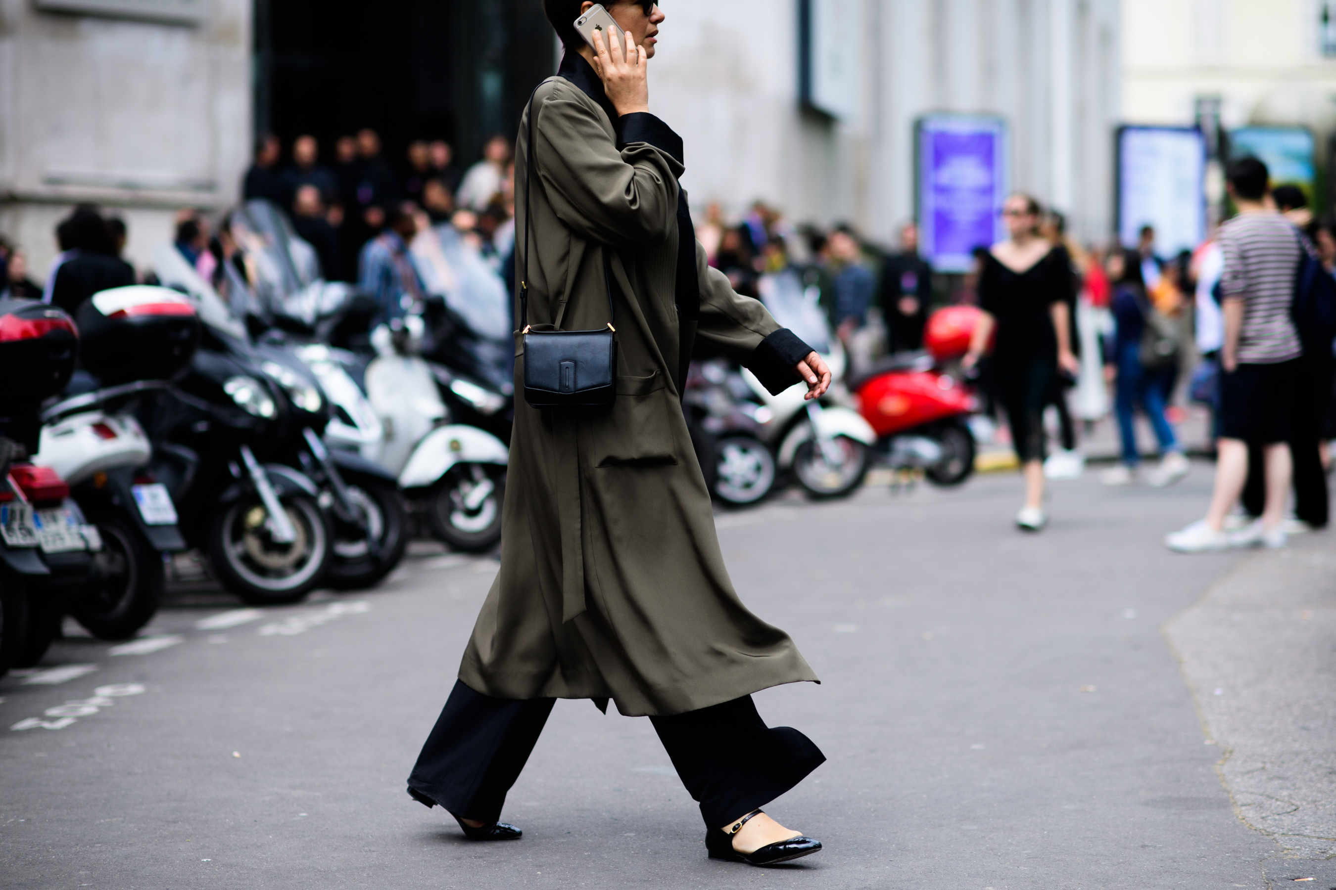 Woman wearing long green coat