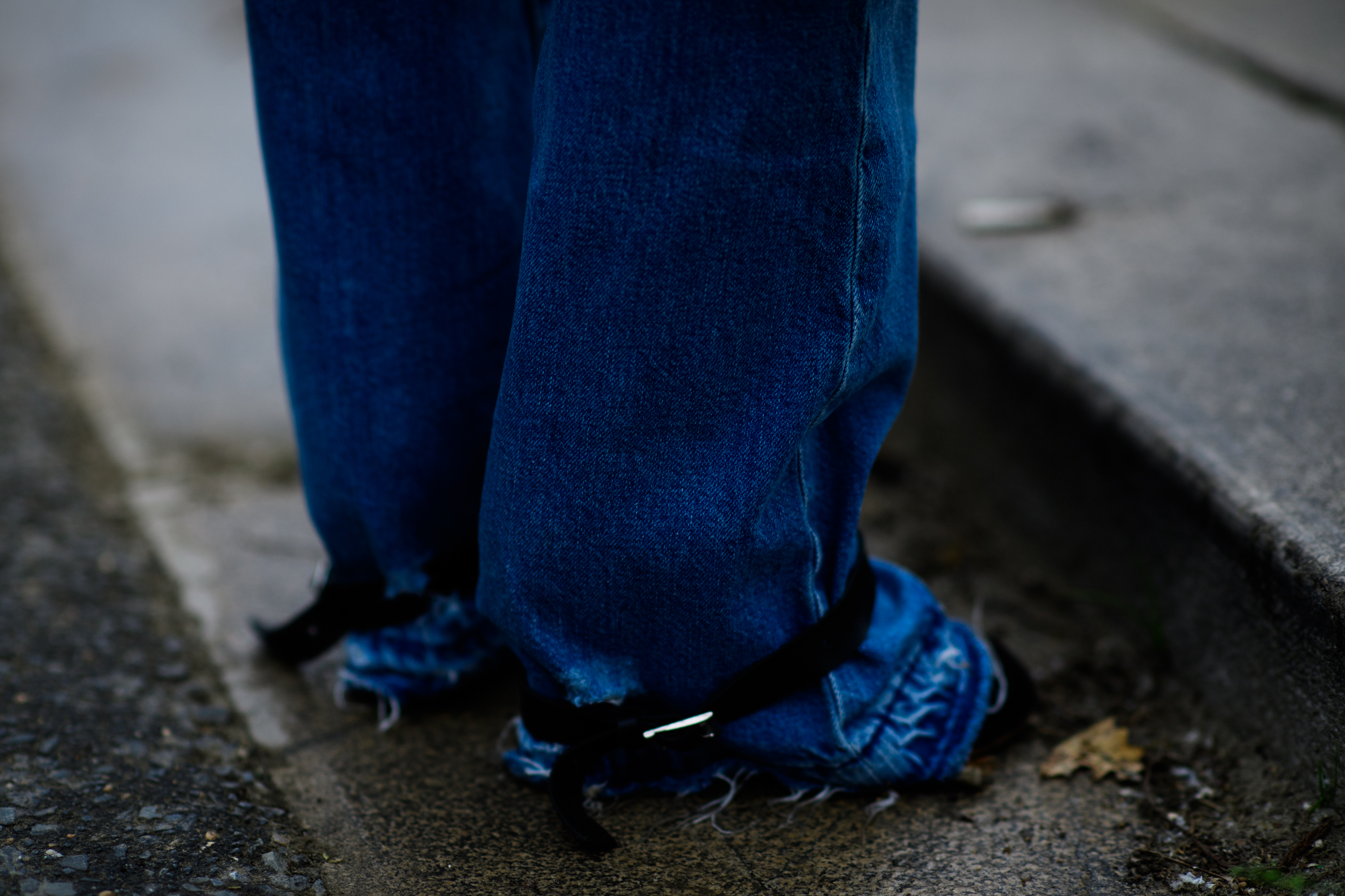 Very long blue jeans