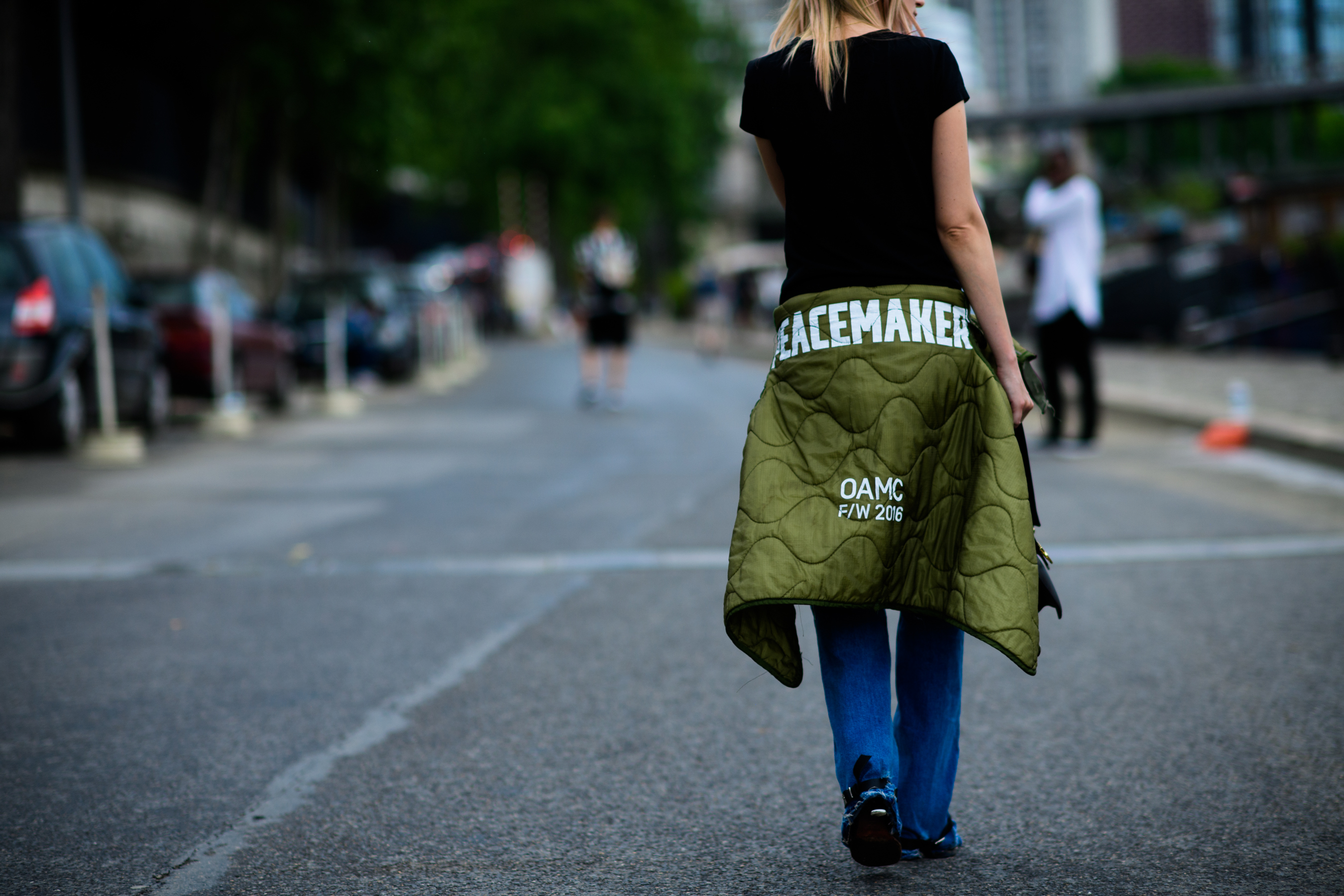 A woman with a light green jacket