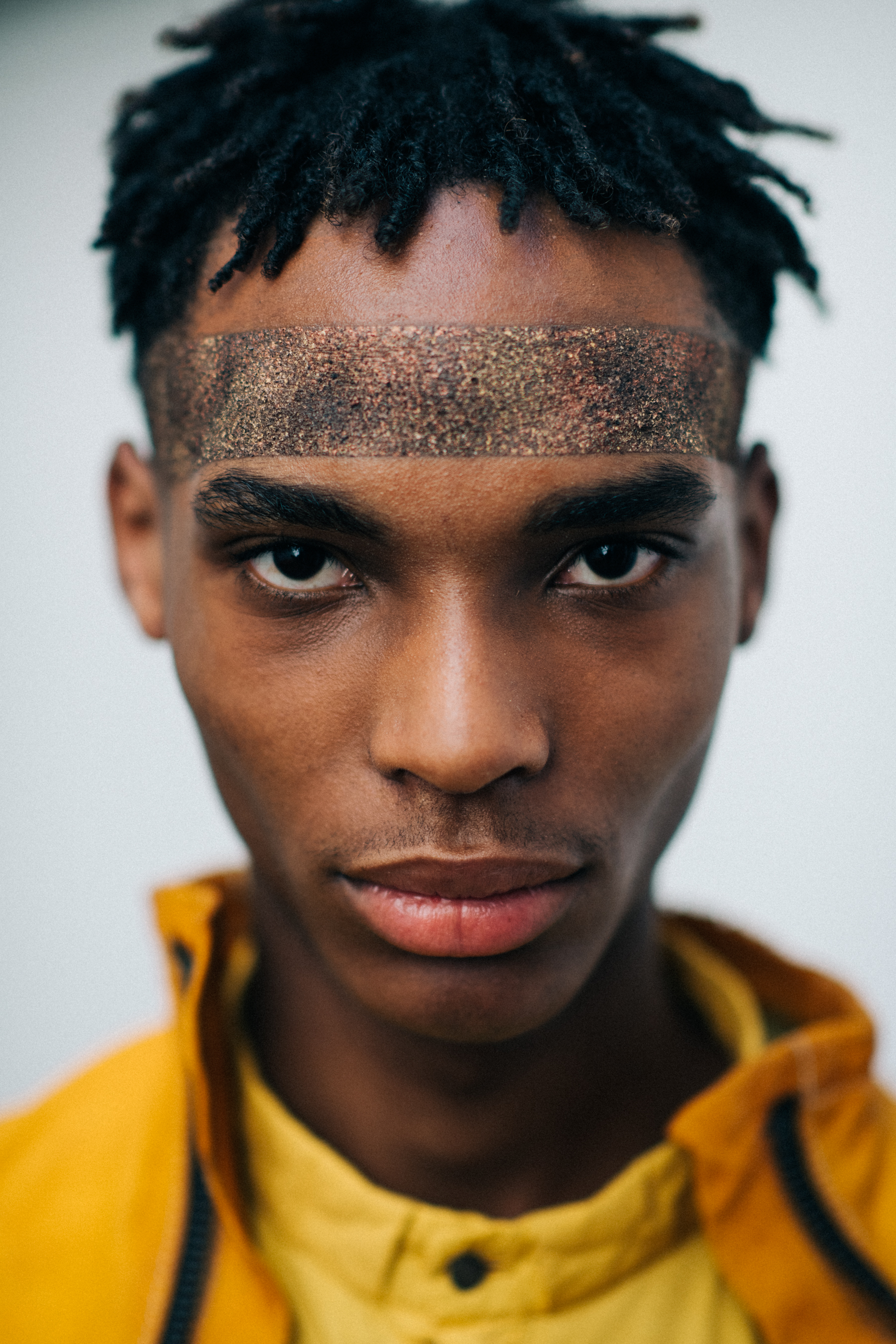 Portrait of a model wearing a yellow outfit