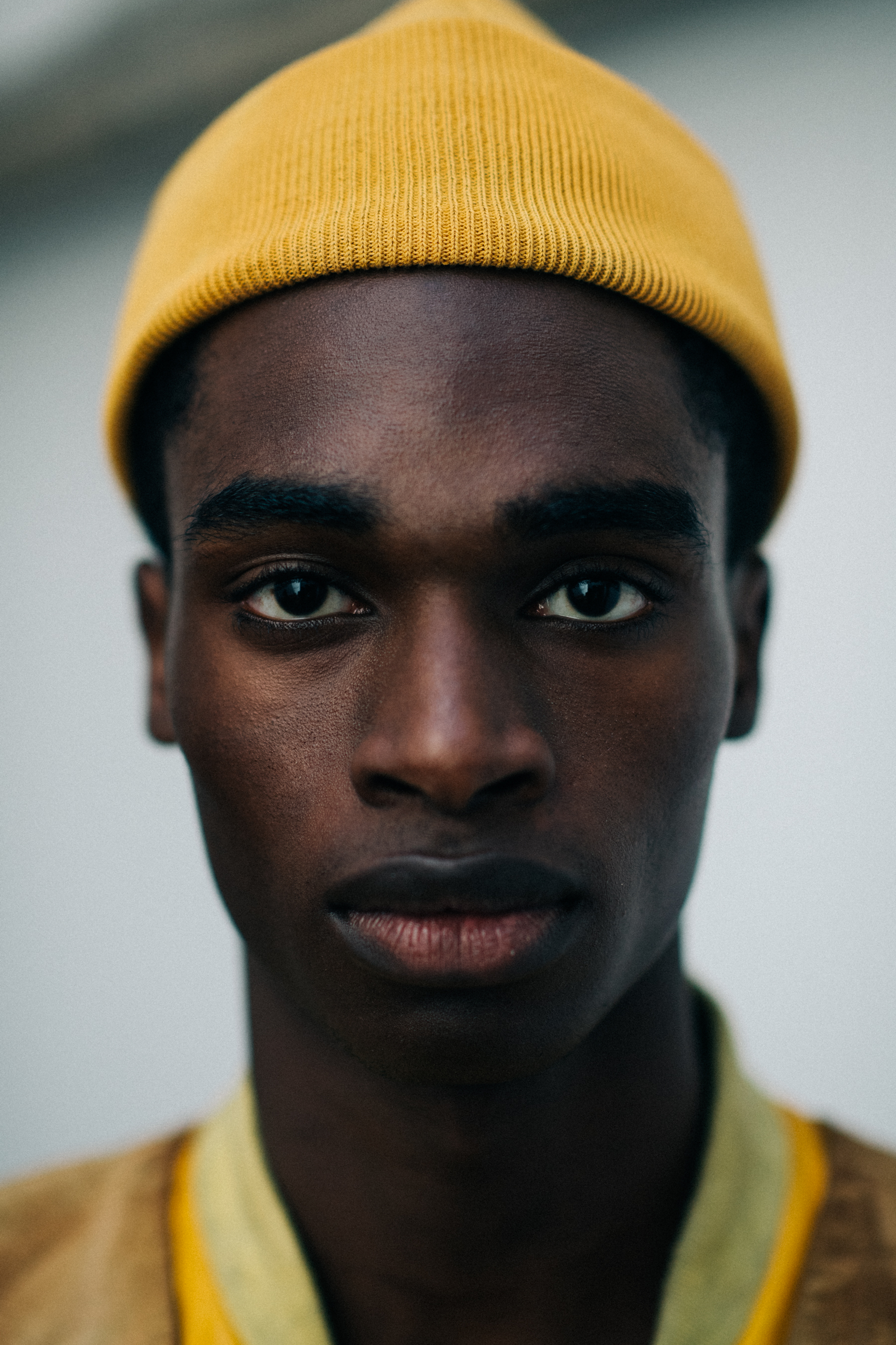 A model wearing a yellow hat
