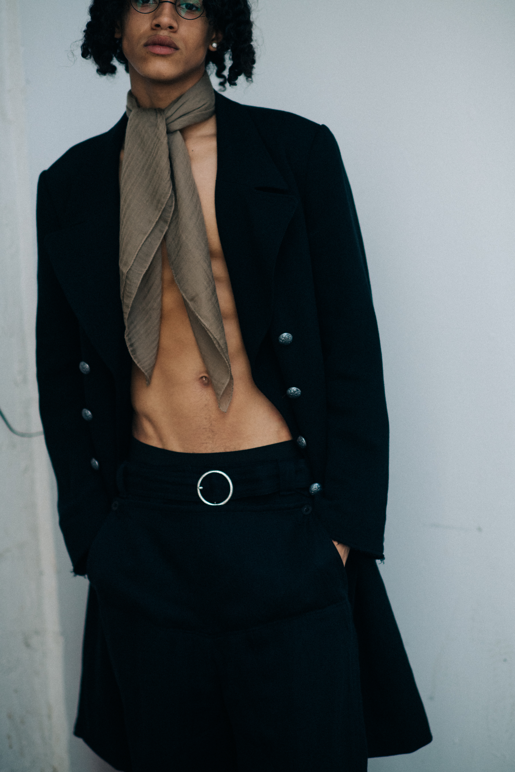 Male model posing in black suit