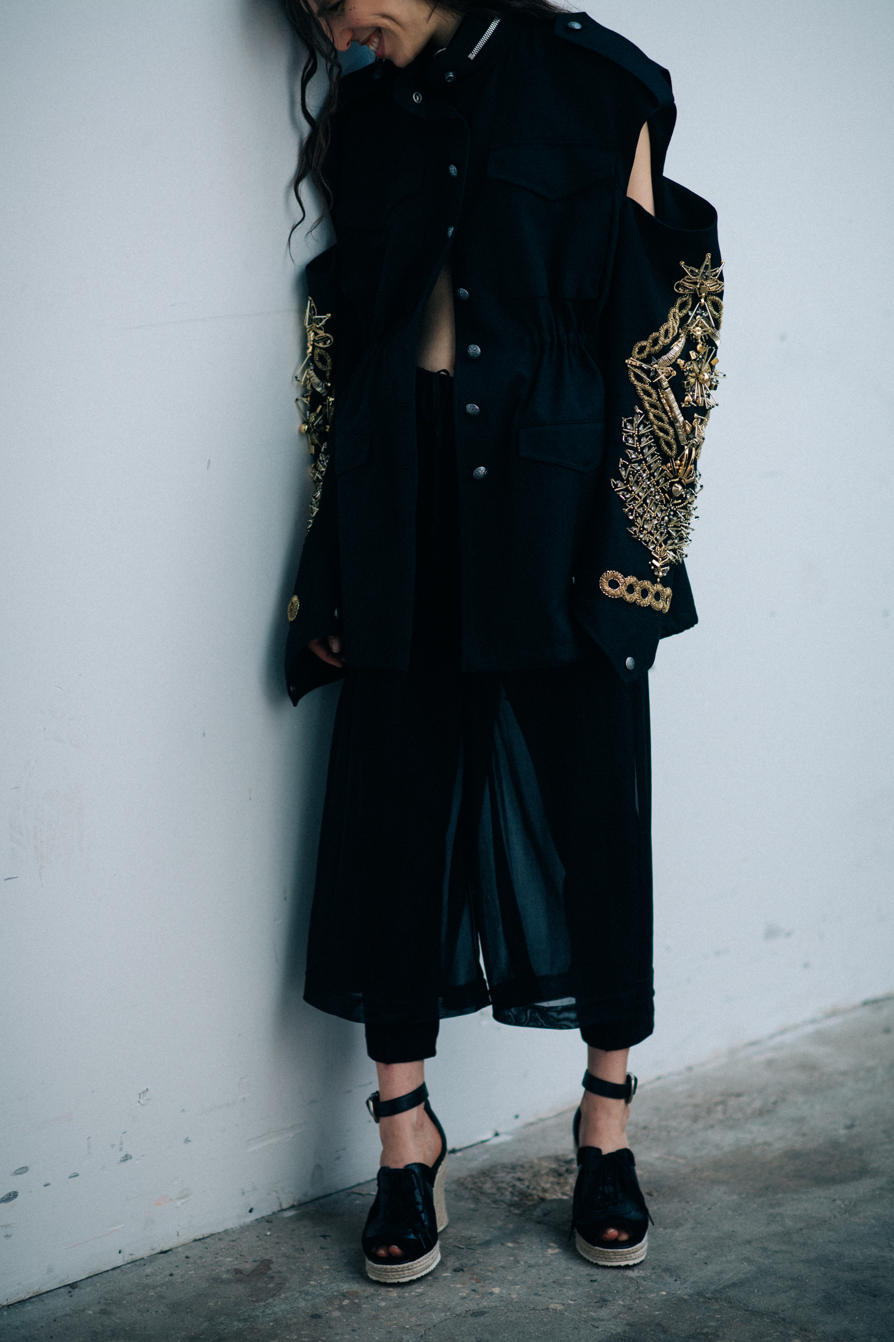 Female model wearing black outfit