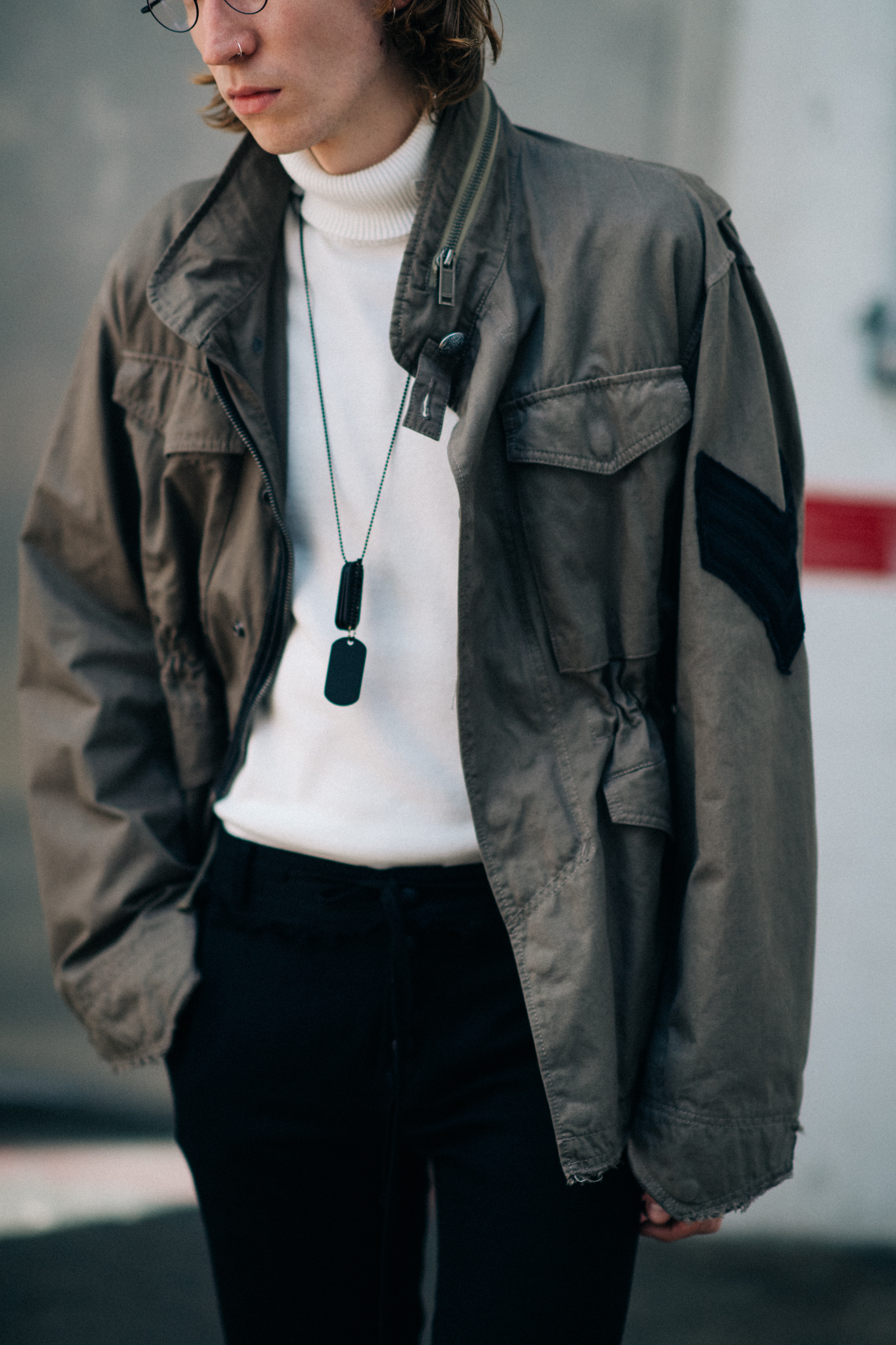 Green jacket worn over turtleneck