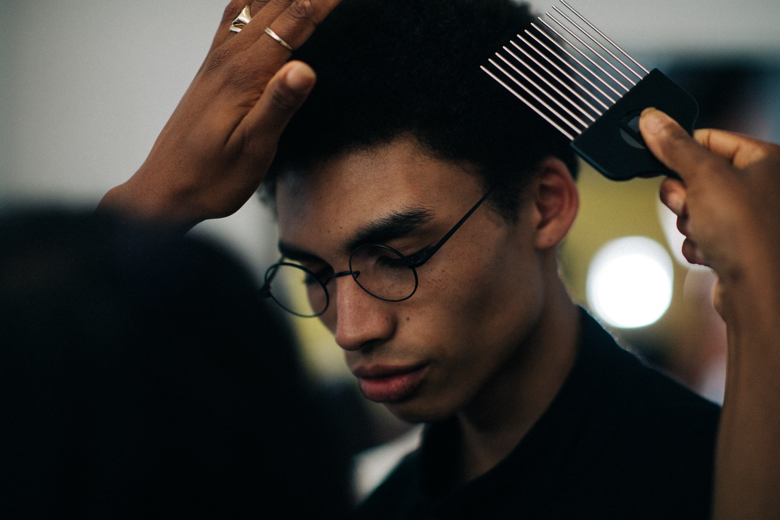 Male model wearing round glasses