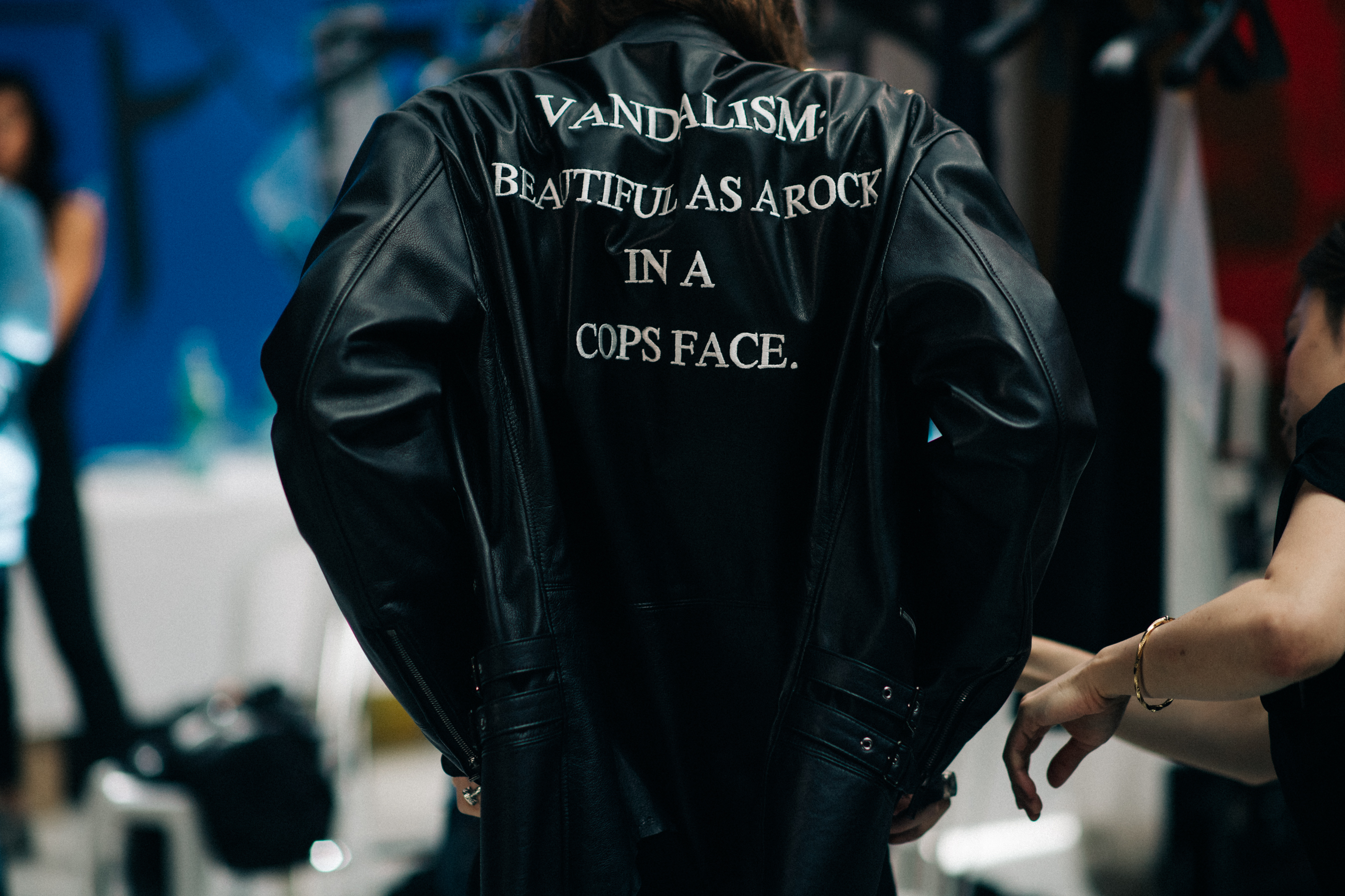 Model in black leather jacket