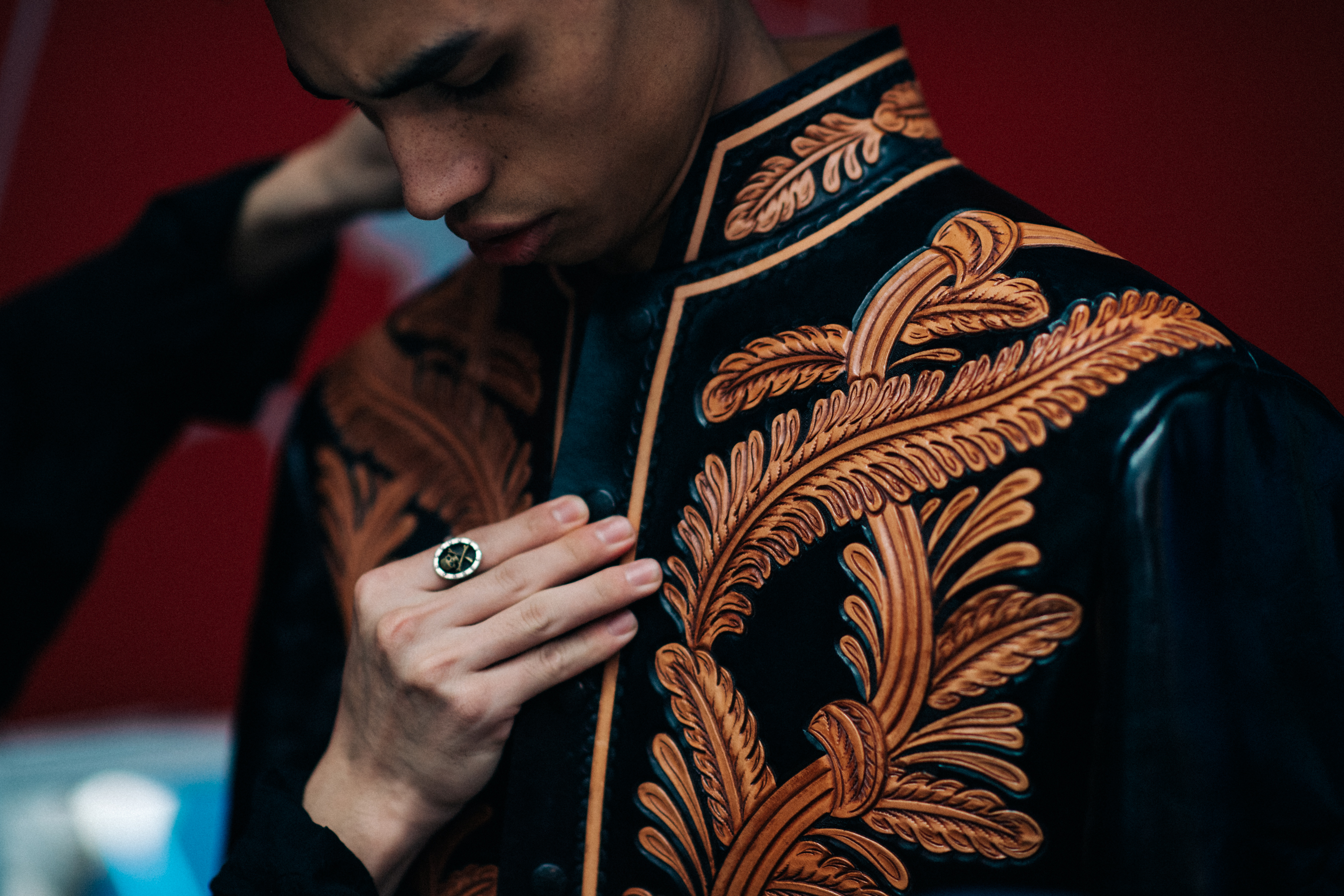 Model in black embroidered jacket