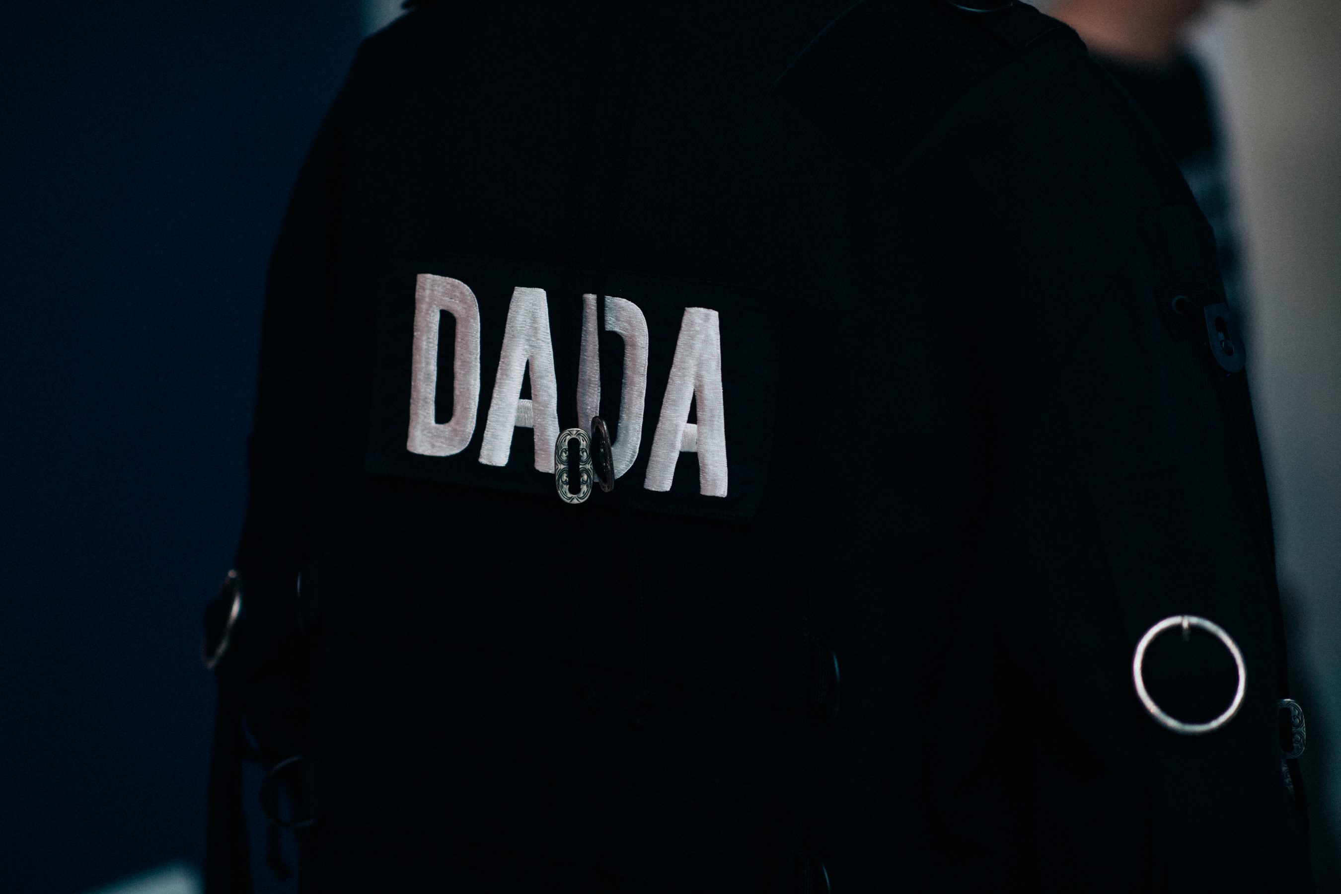 White sign on black jacket
