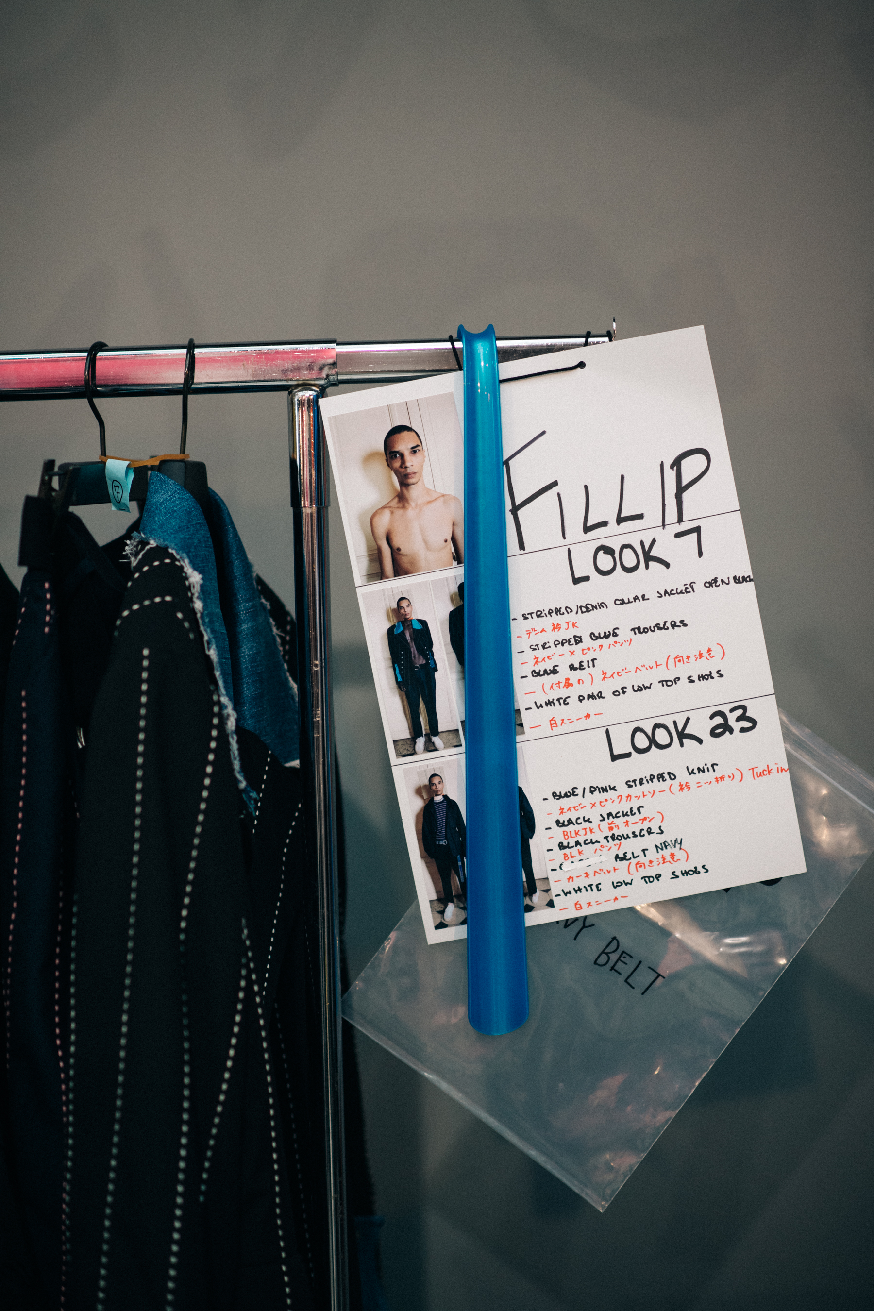 Rail with clothes and pictures