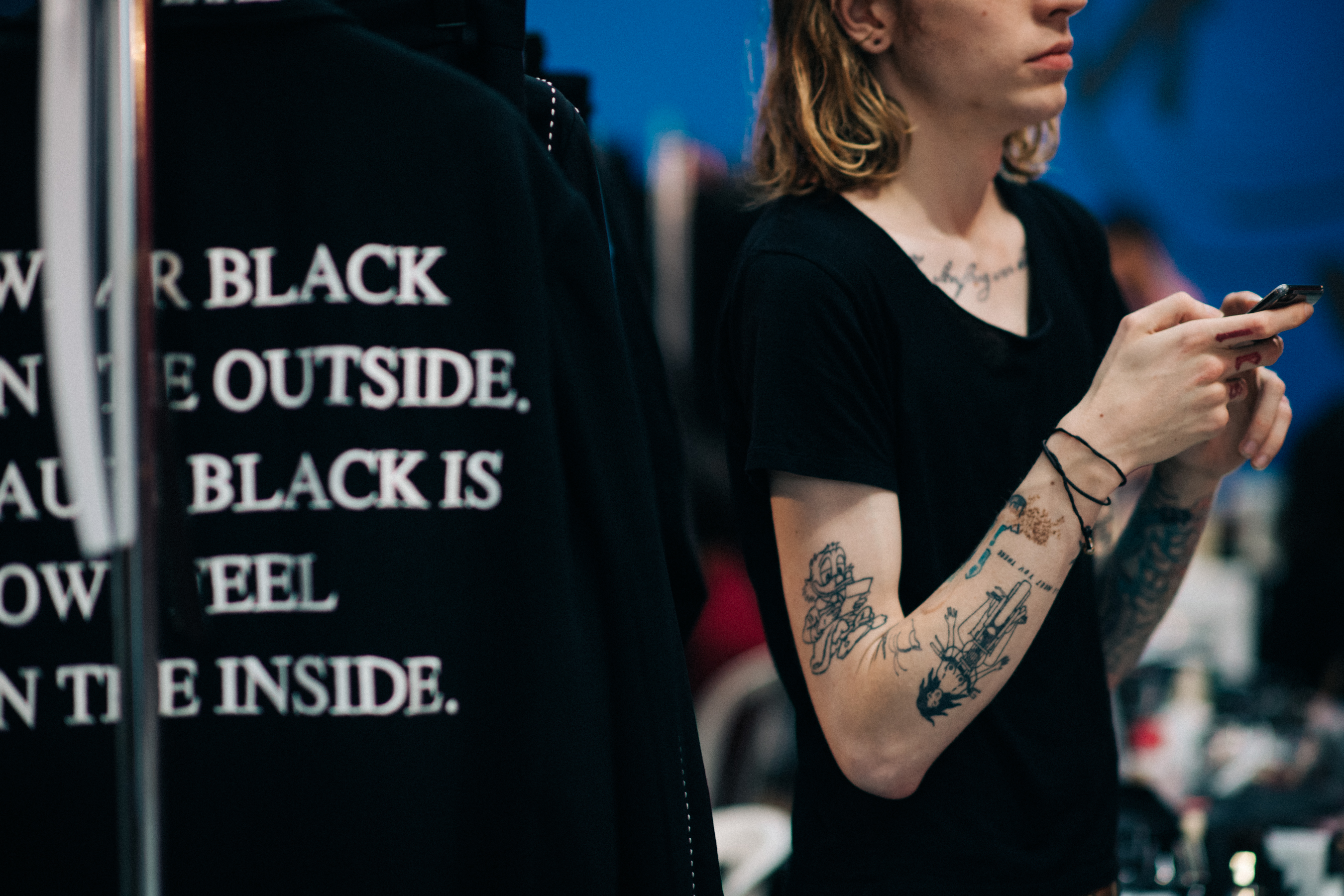 Tattooed model in black T-Shirt