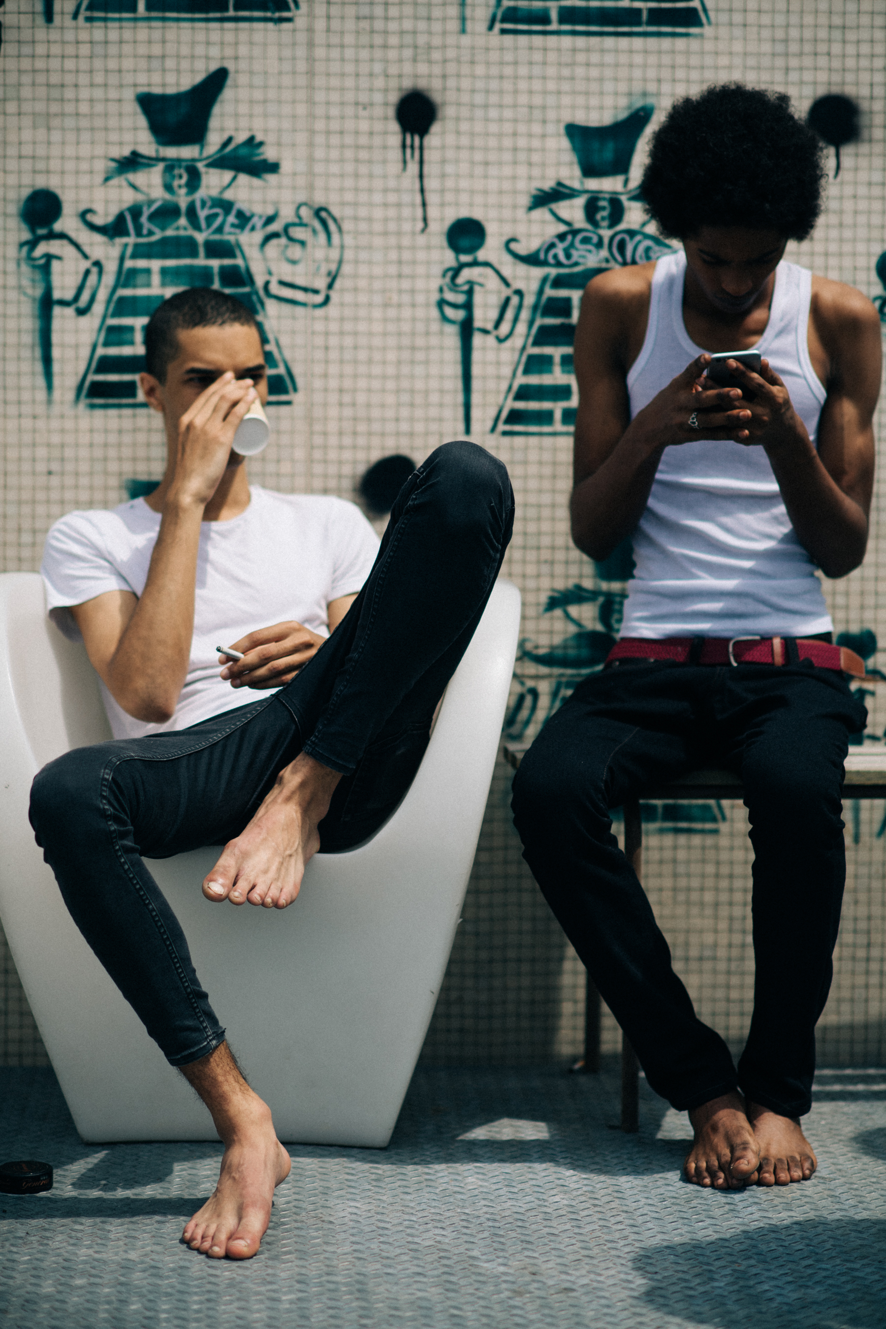Male models wearing white tops