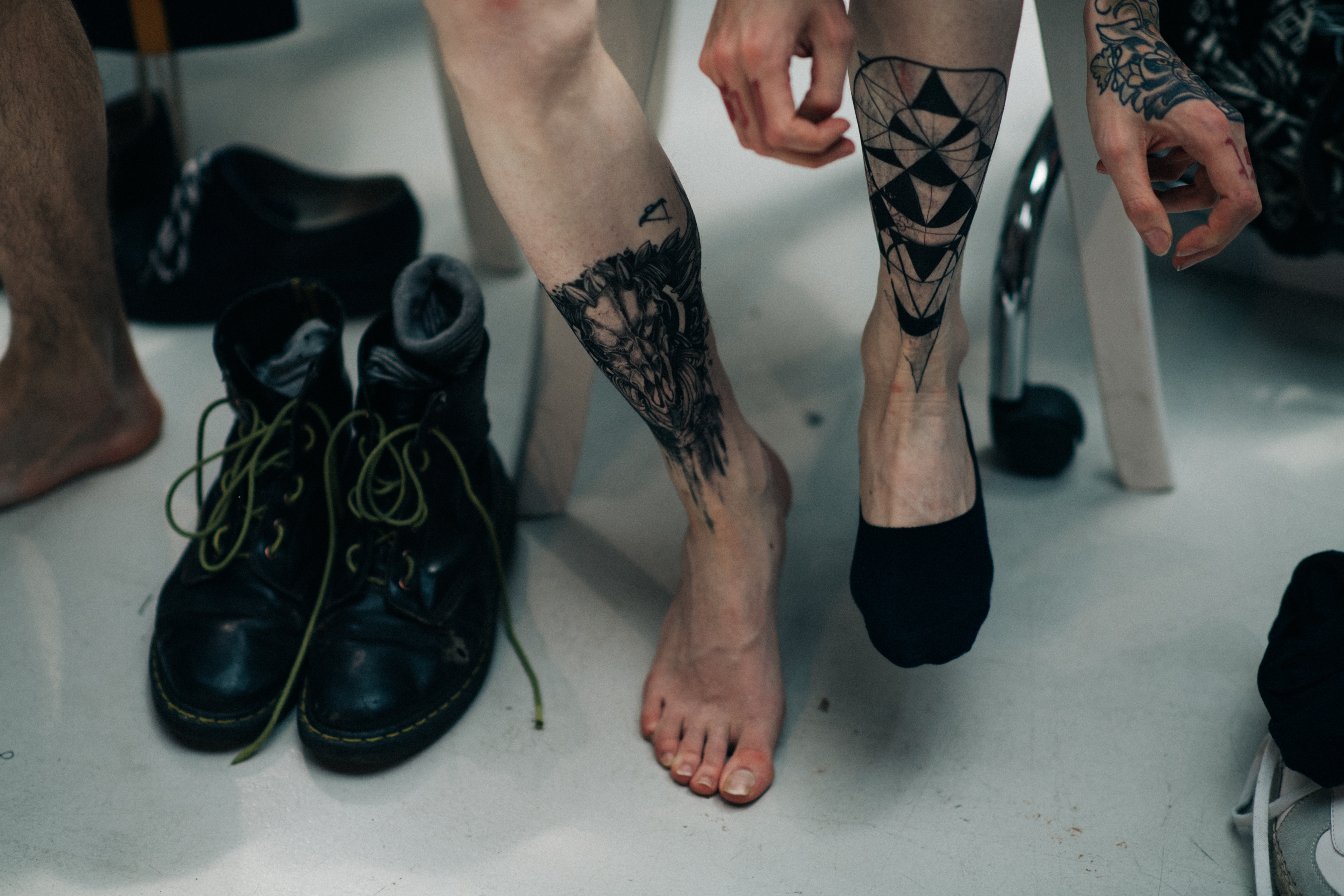 Tattoos on male models legs