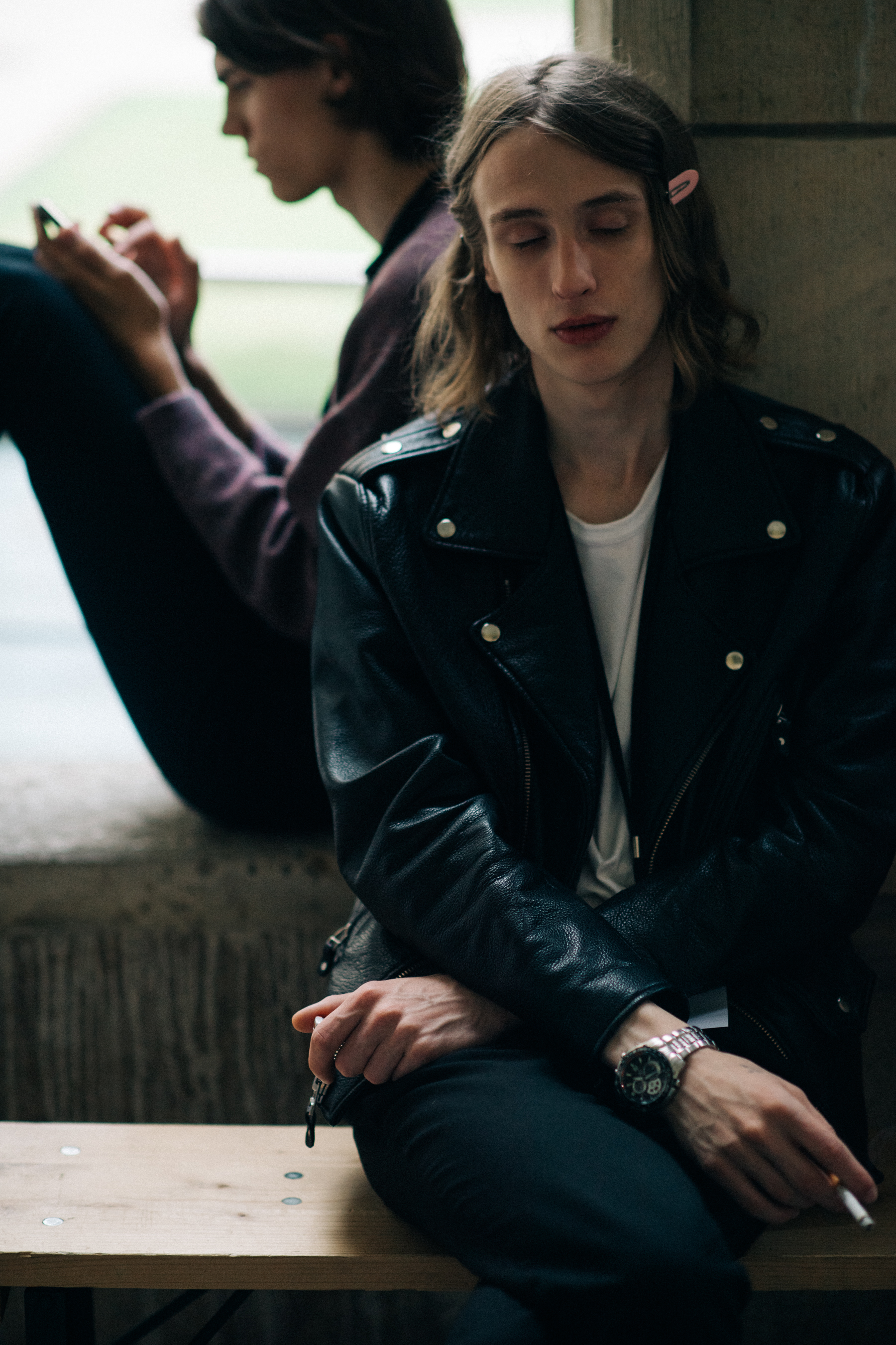 Male models hanging out backstage