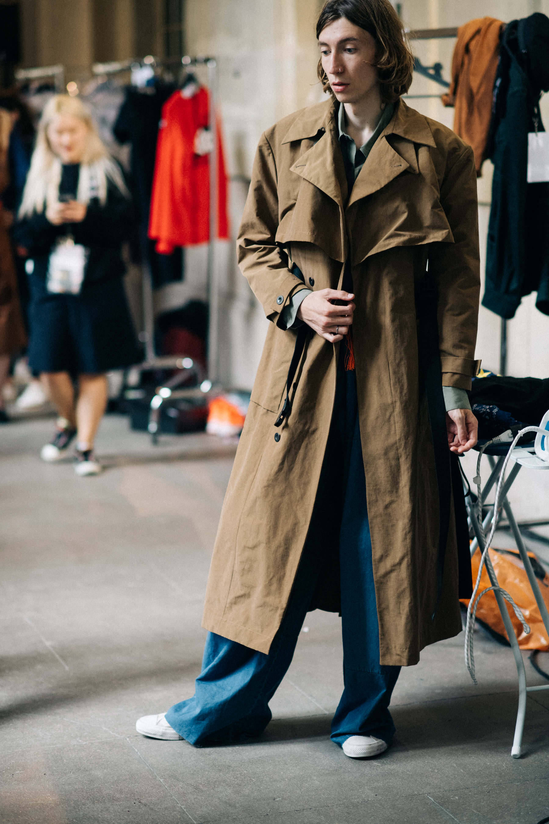 Model wearing beige trench coat