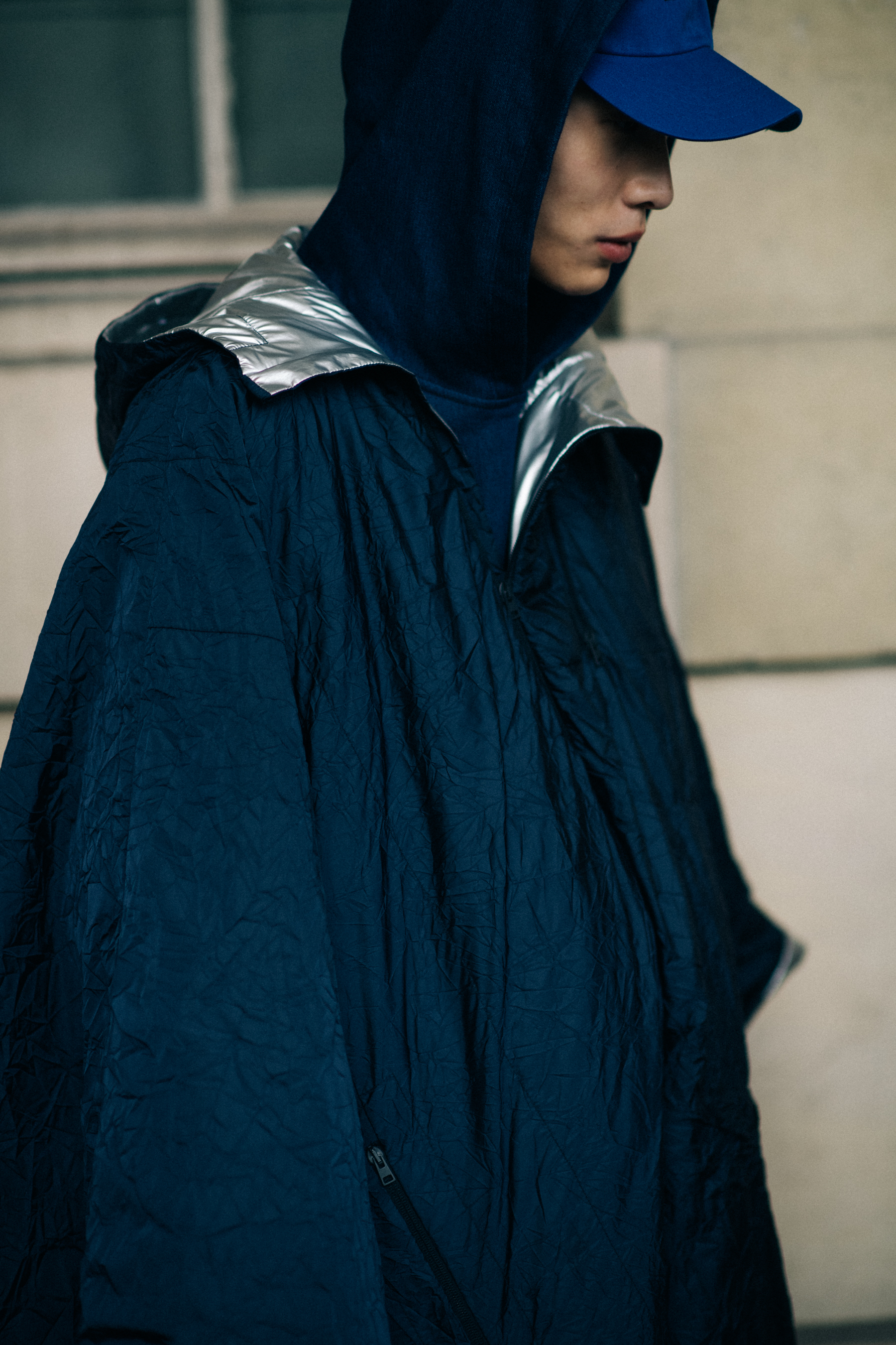 Male model wearing blue coat
