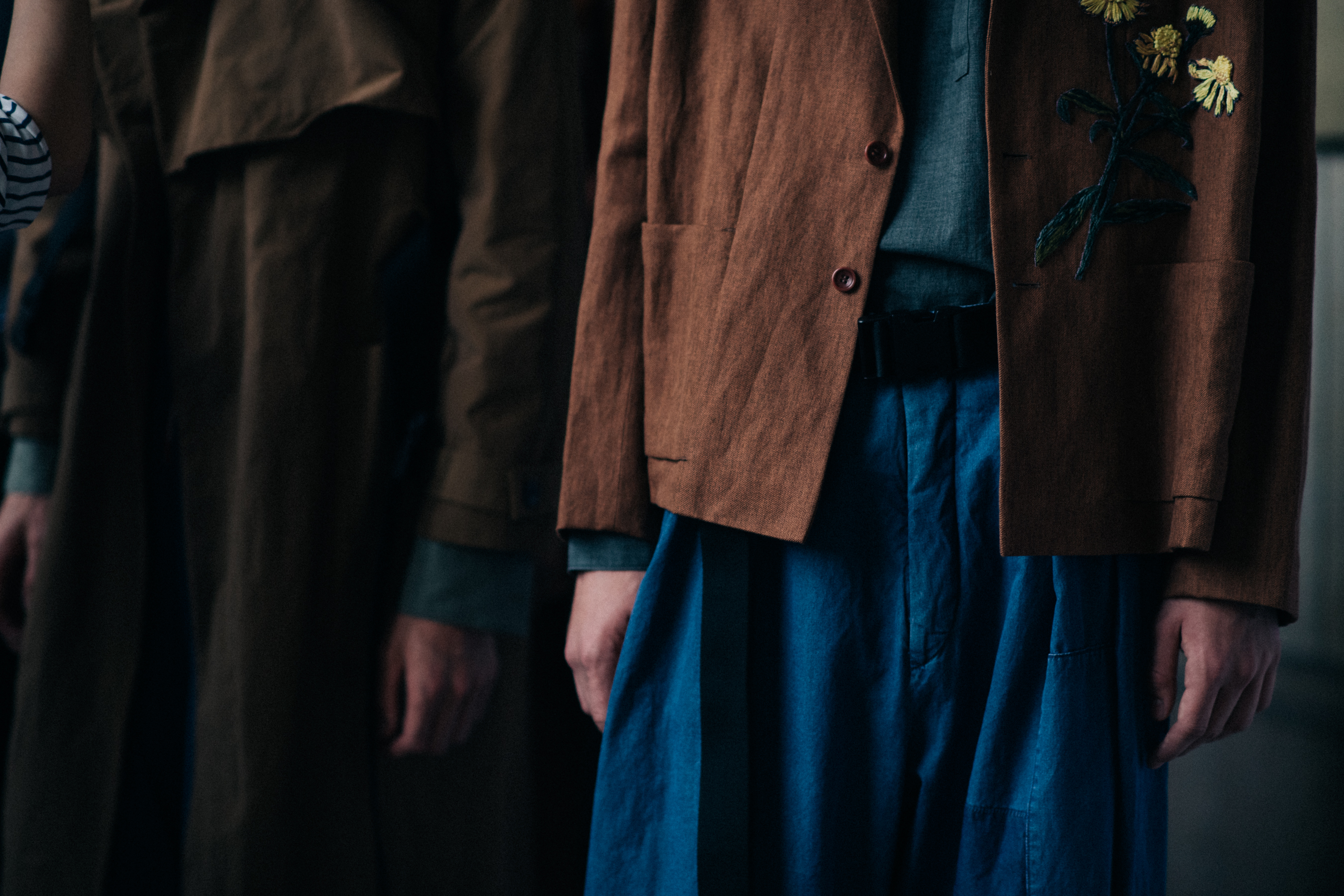 Model wearing brown and blue