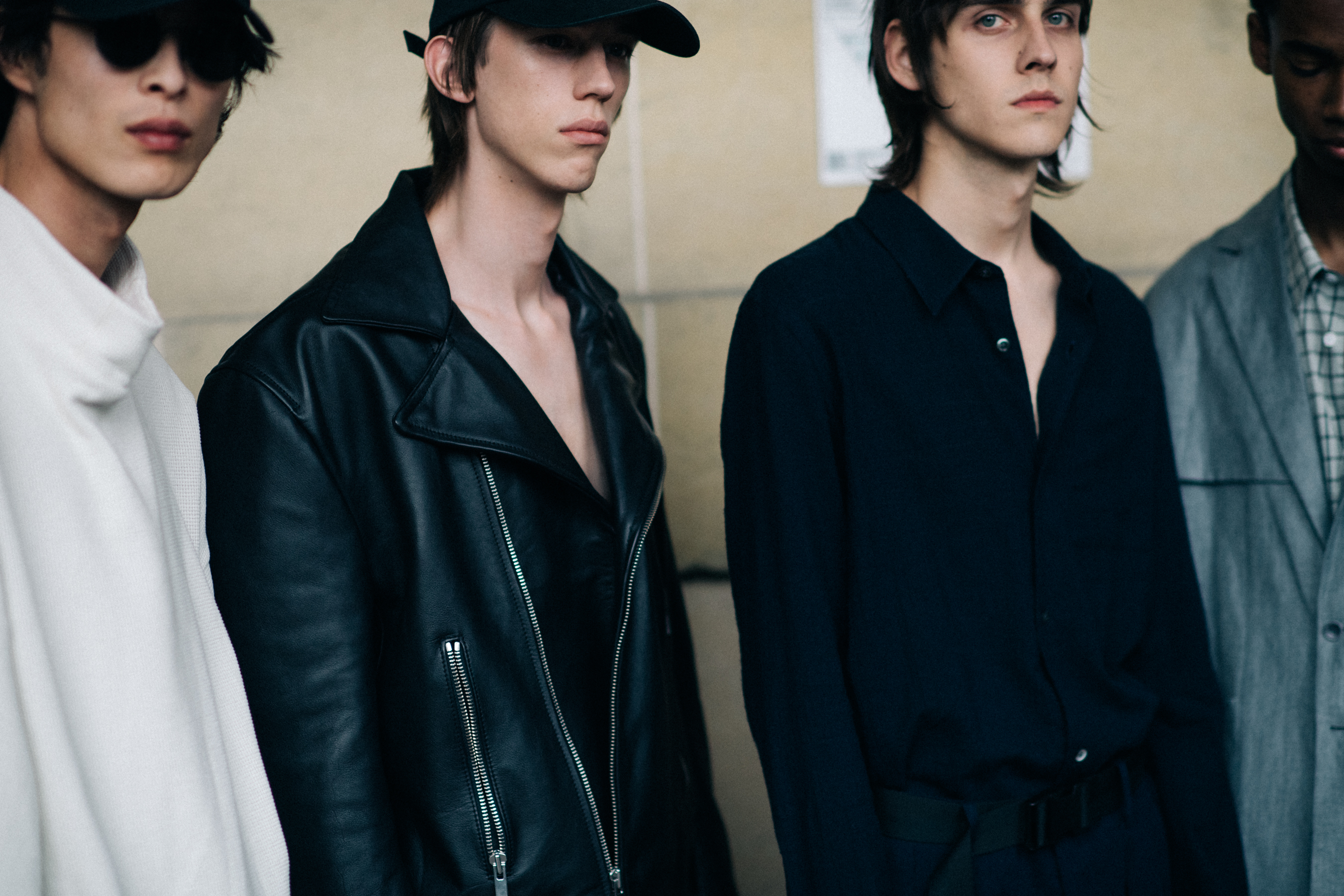 Male models posing for photographers