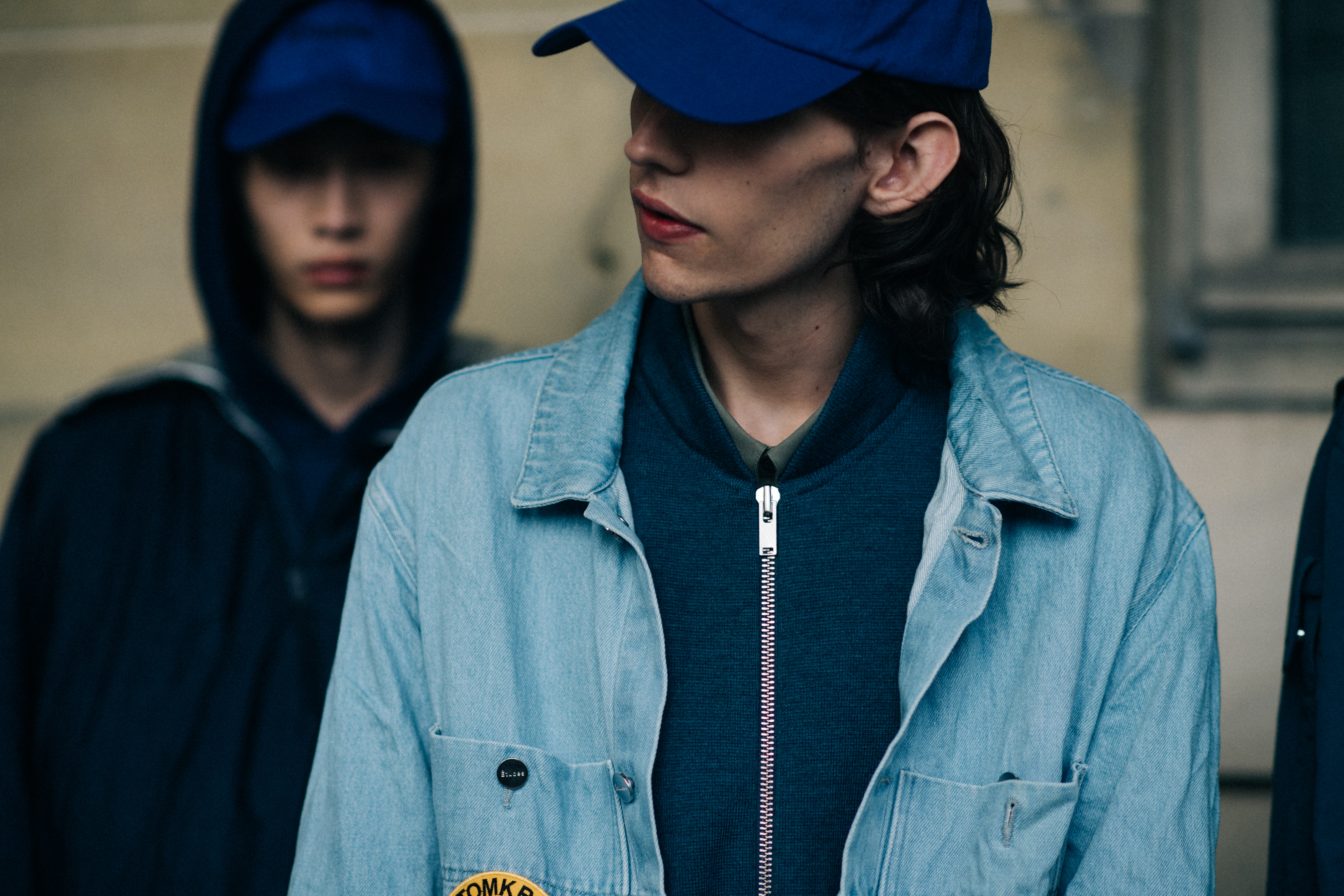 Male models wearing blue caps
