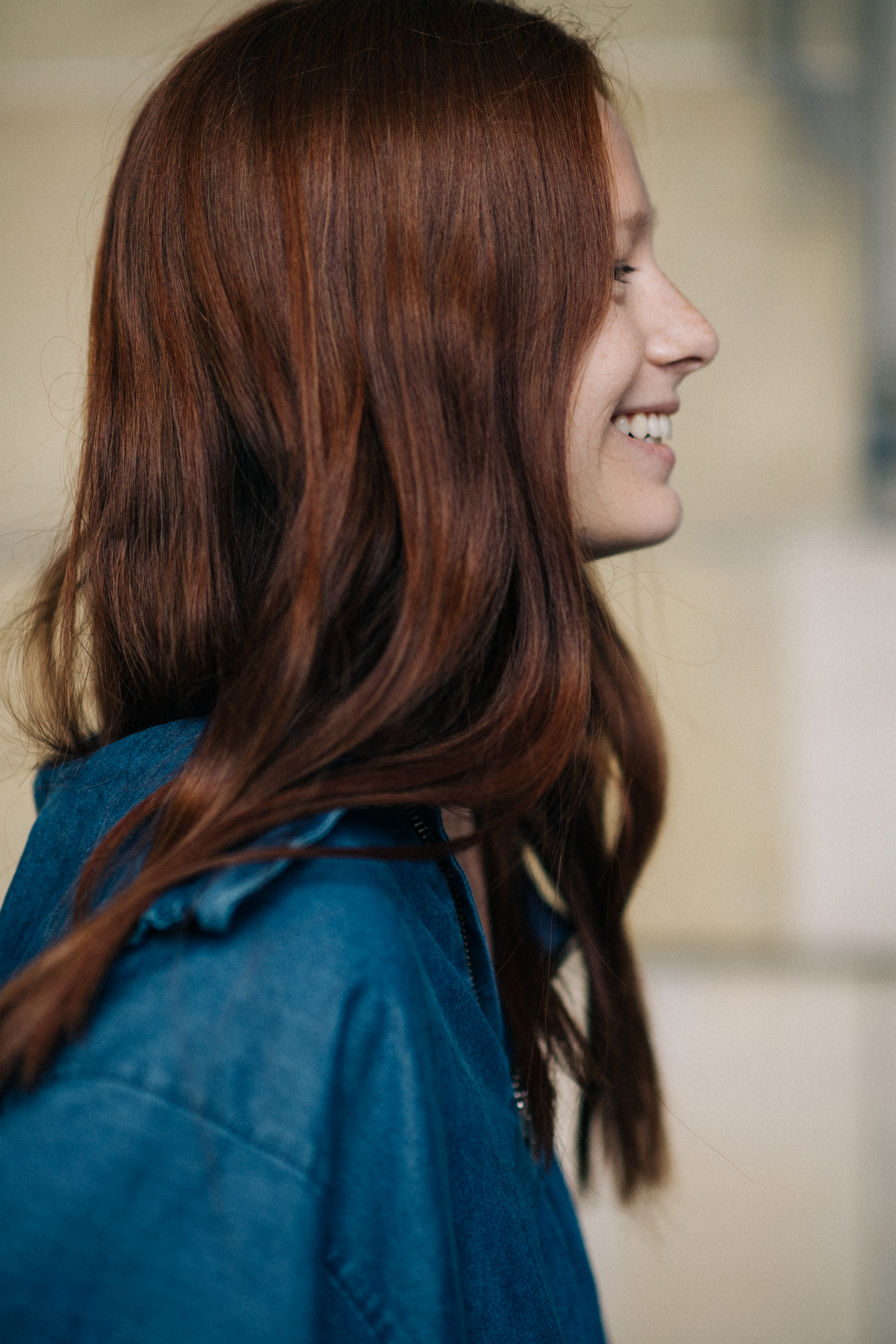 Red-haired female model smiling