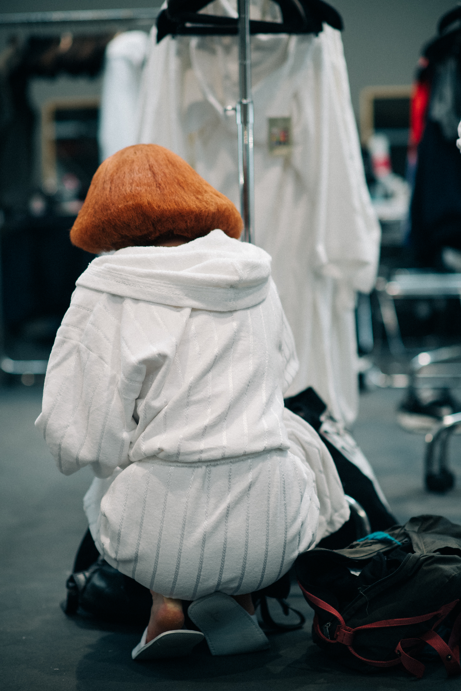 A red-haired model in all white