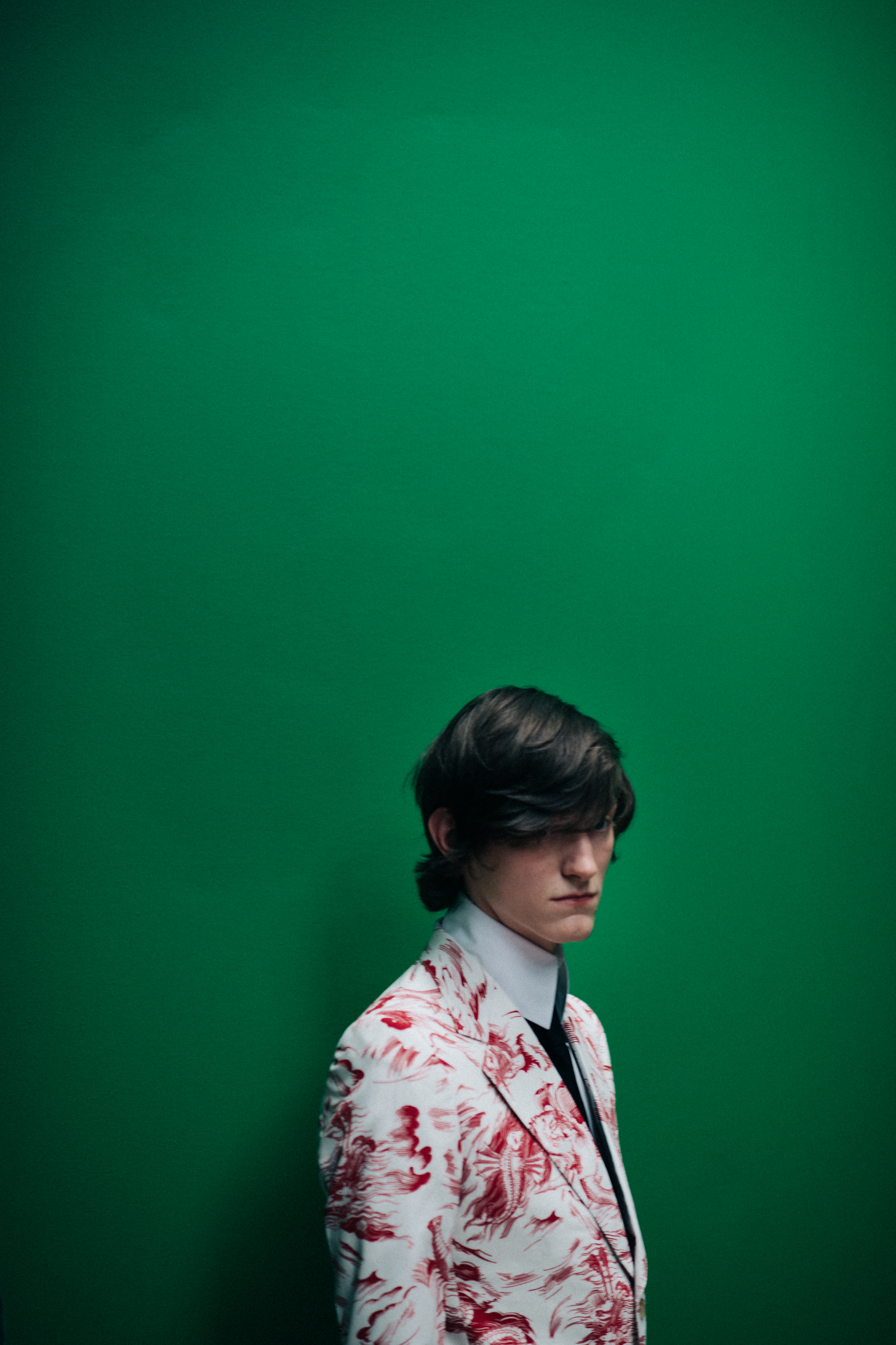 A dark-haired model in a suit