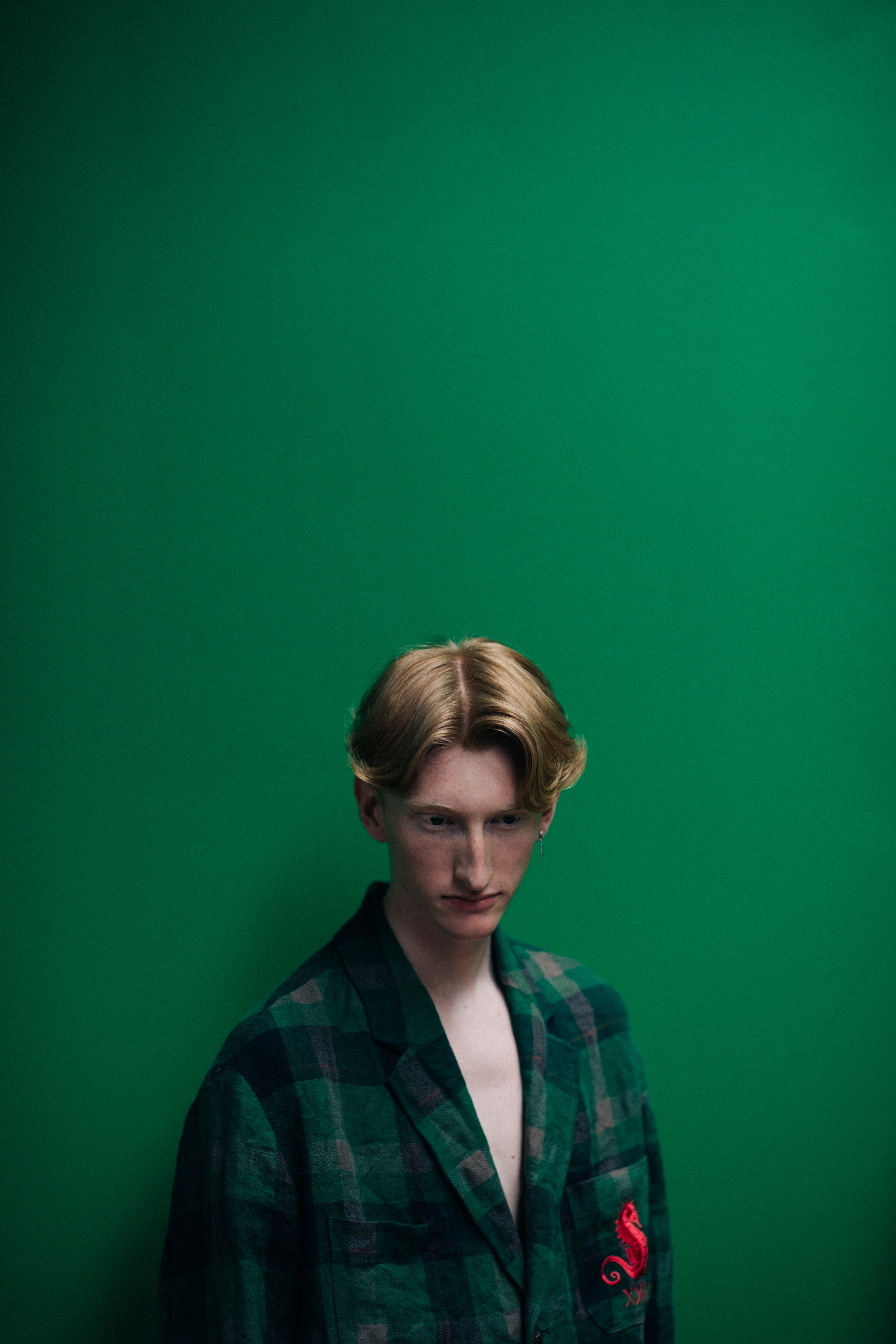A male model in a green coat