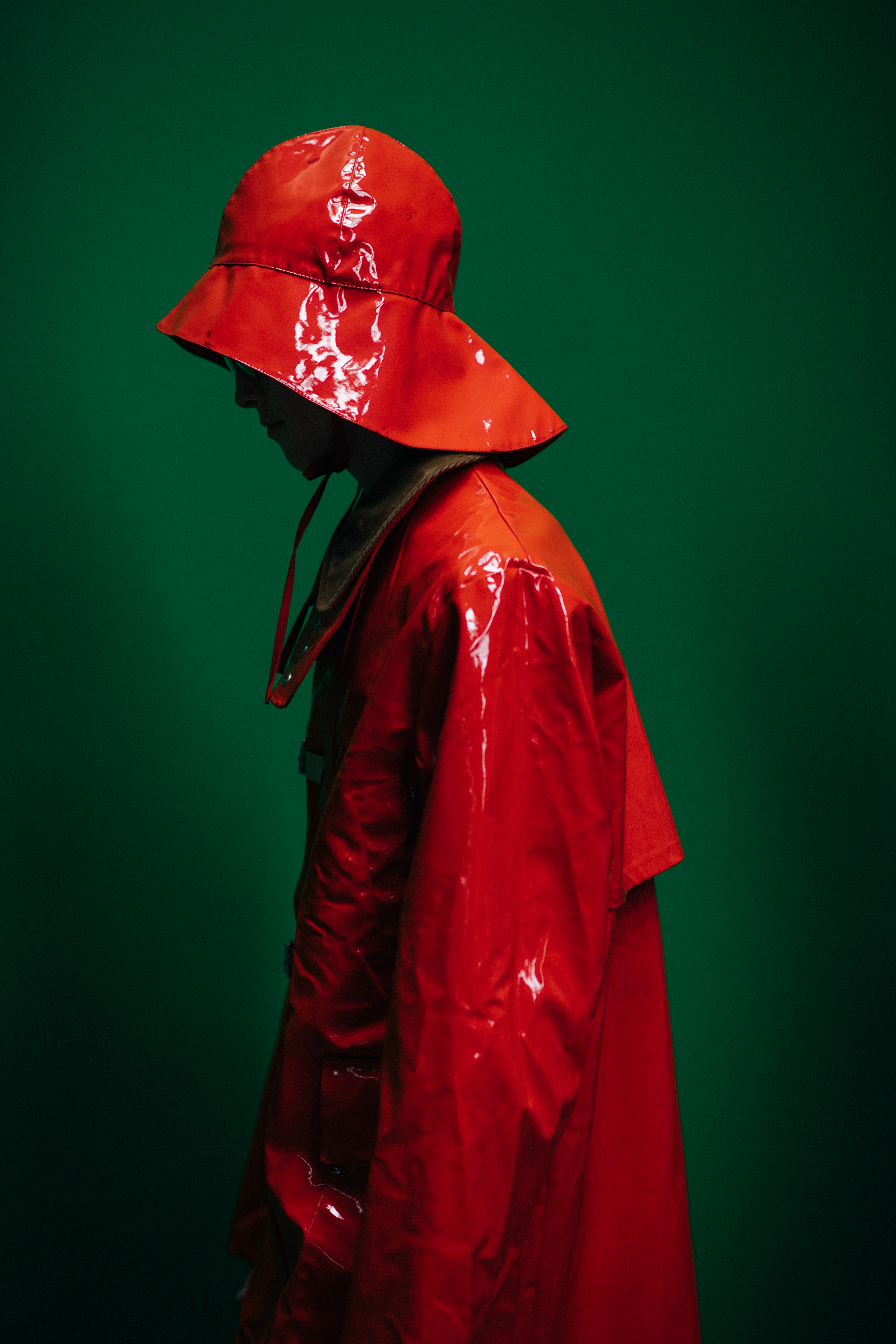A model in a bright orange outfit
