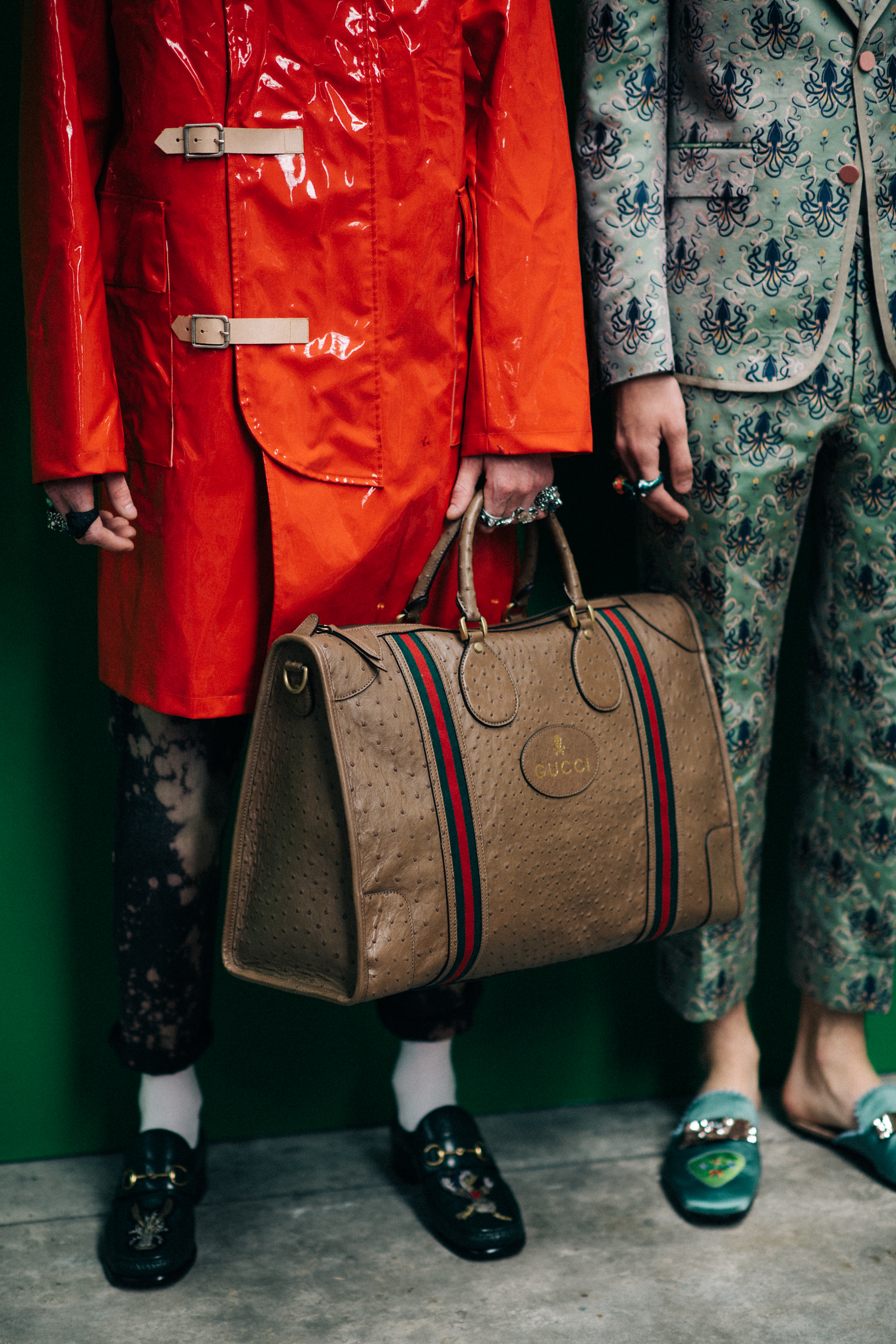 A model holding a travel bag